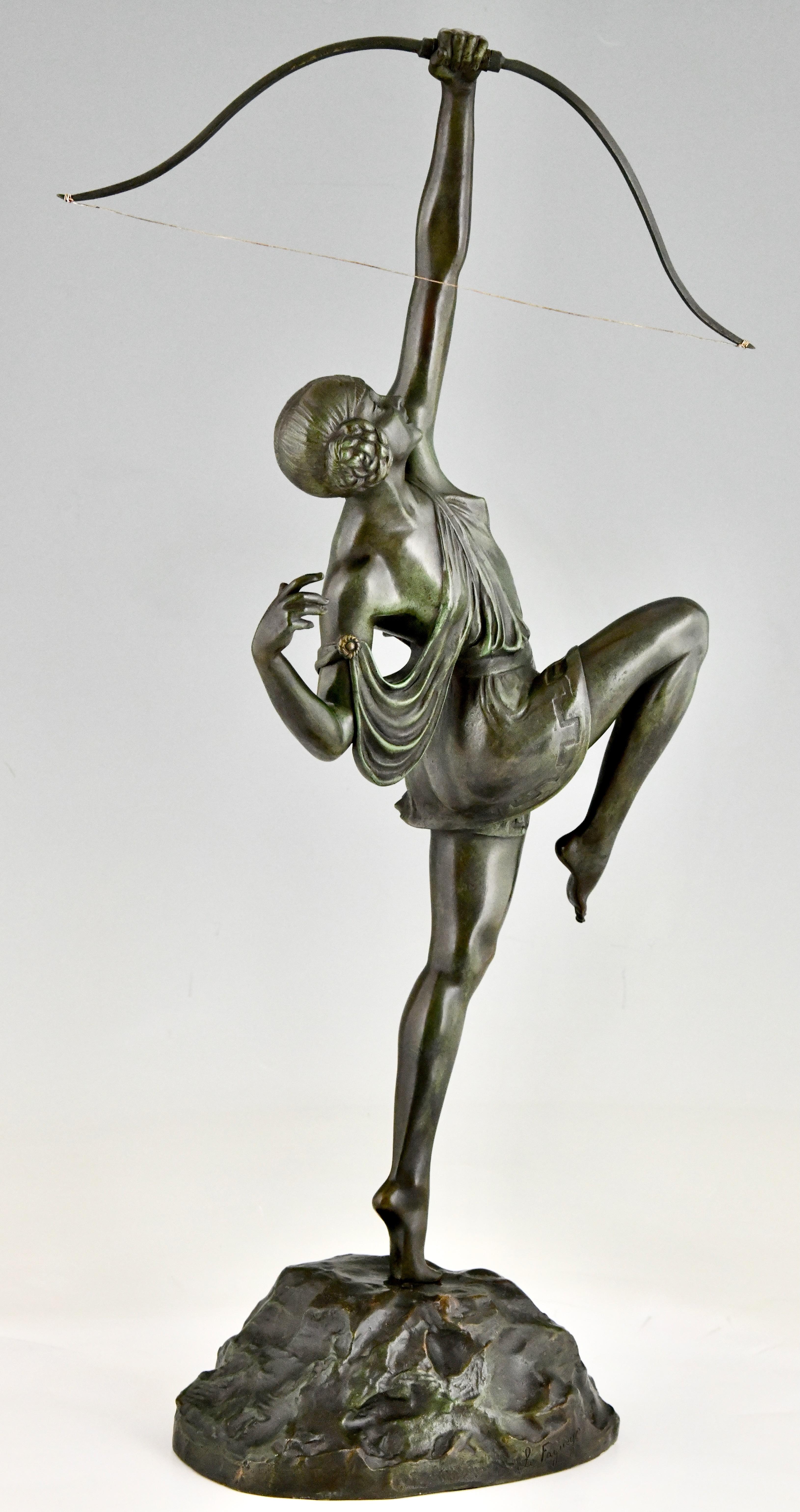 Art Deco Diana with bow bronze sculpture by Pierre Le Faguays. 
Founders signature Susse Frères Editeurs Paris and foundry seal.
Green patina, France 1925.
There is a picture of this model on page 424 of
Bronzes, sculptors and founders by H. Berman,