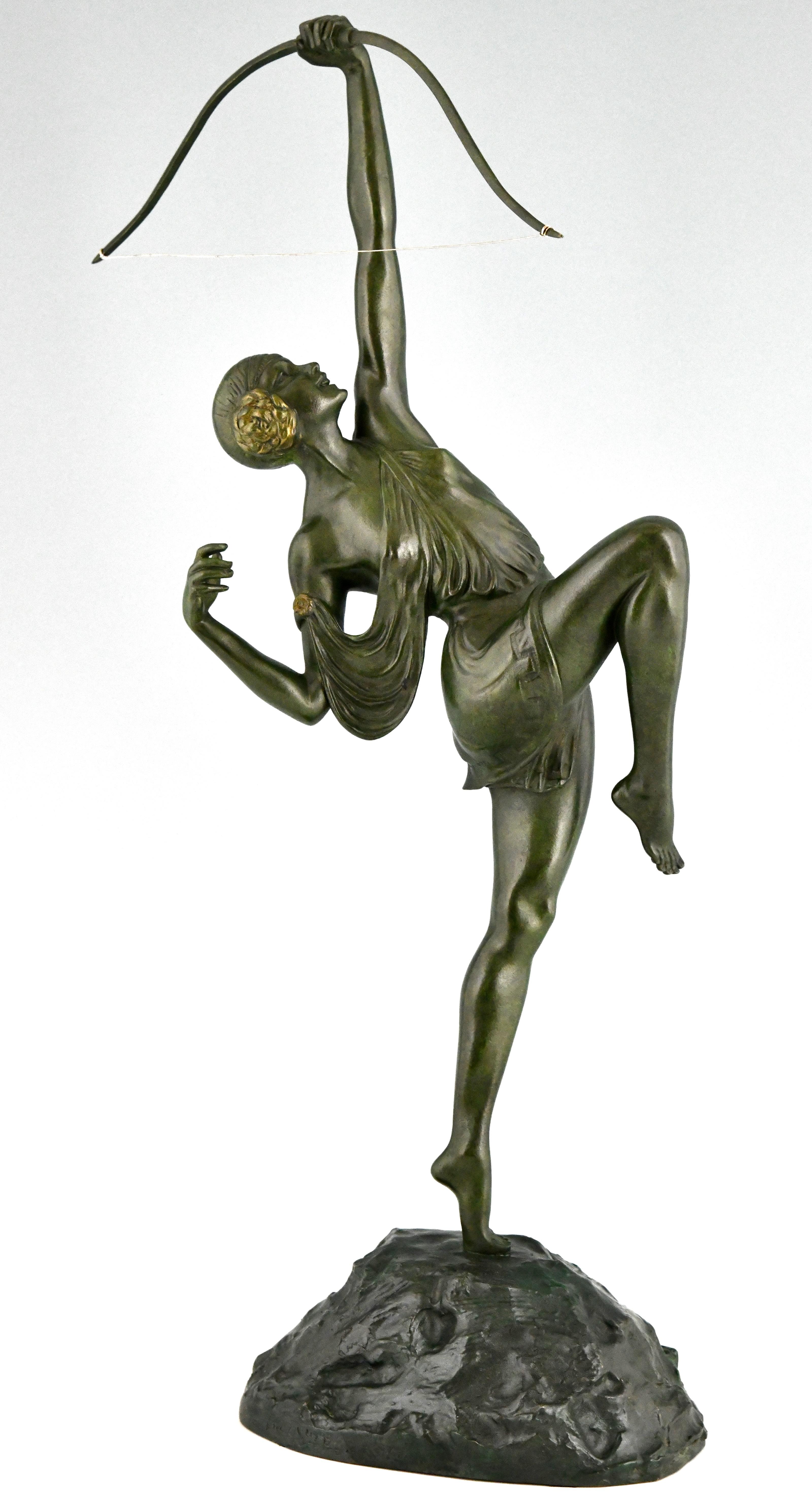 Art Deco Diana with bow bronze sculpture by Pierre Le Faguays. 
Founders signature Susse Frères Editeurs Paris and foundry seal.
Green patina, France 1925.
There is a picture of this model on page 424 of
Bronzes, sculptors and founders by H. Berman,
