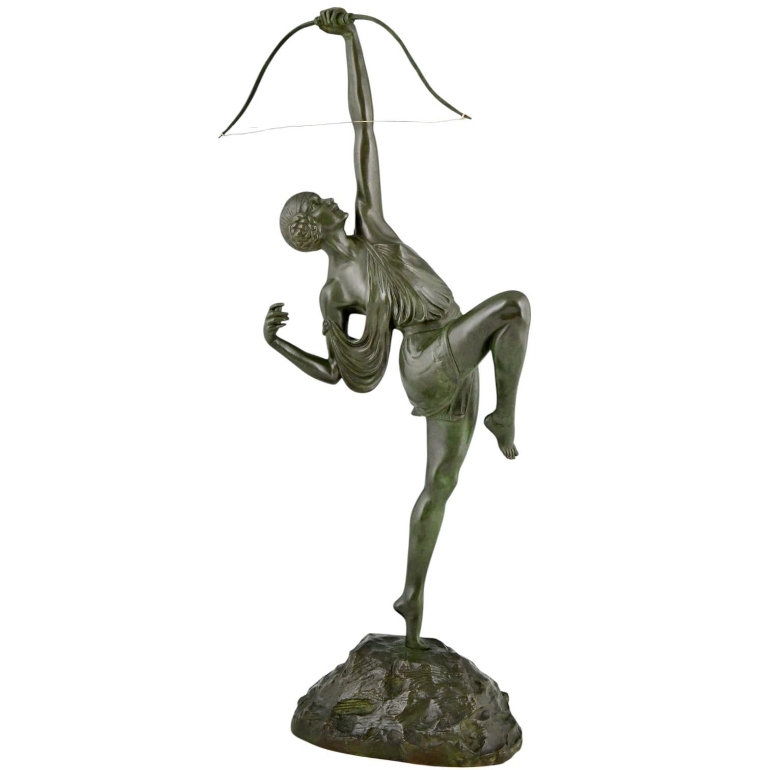 Art Deco Diana with bow bronze sculpture by Pierre Le Faguays. 
Founders signature Susse Frères Editeurs Paris and foundry seal.
Green patina, France 1925.
There is a picture of this model on page 424 of
Bronzes, sculptors and founders by H. Berman,