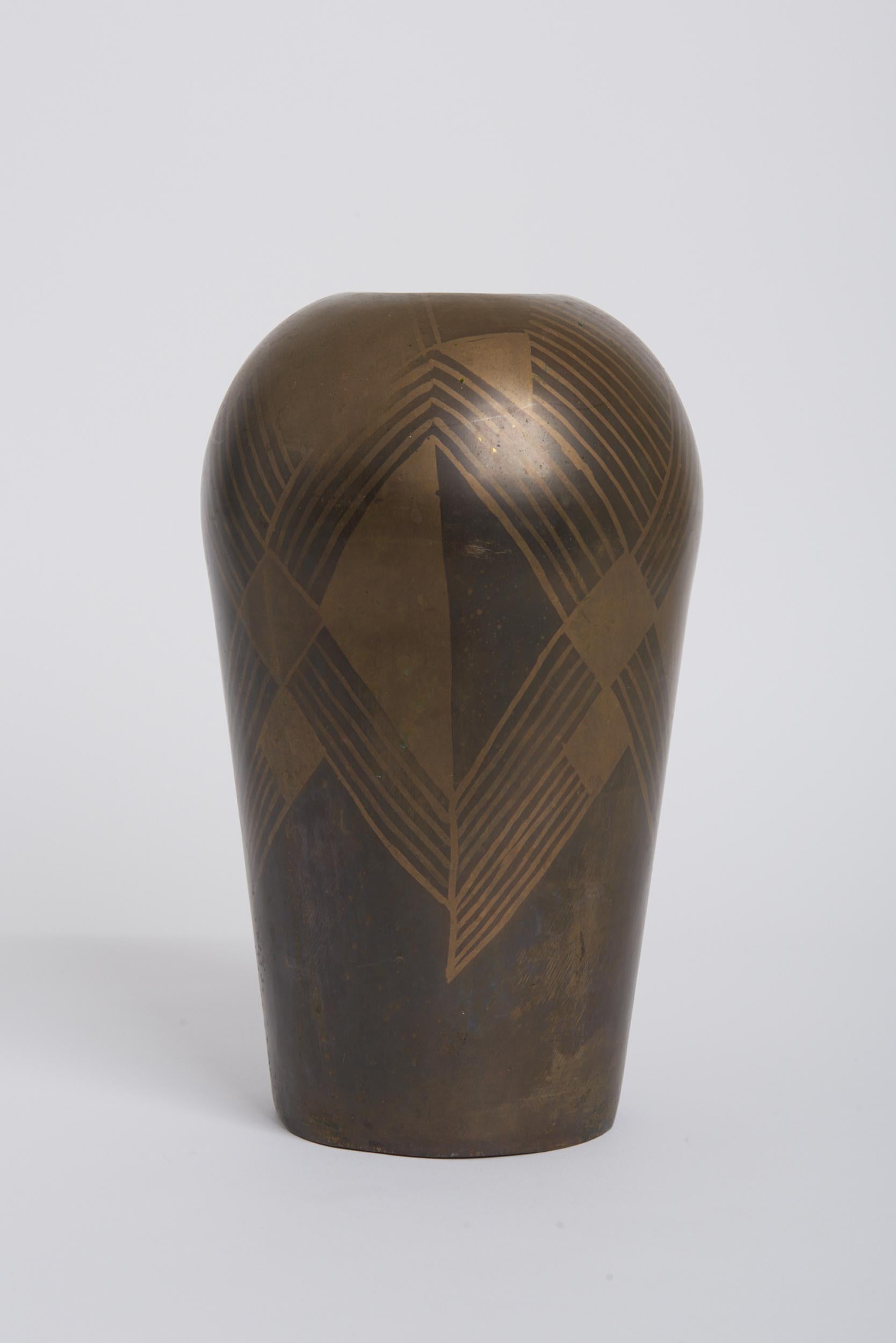 An Art Deco brass dinanderie vase.
France, Circa 1930.