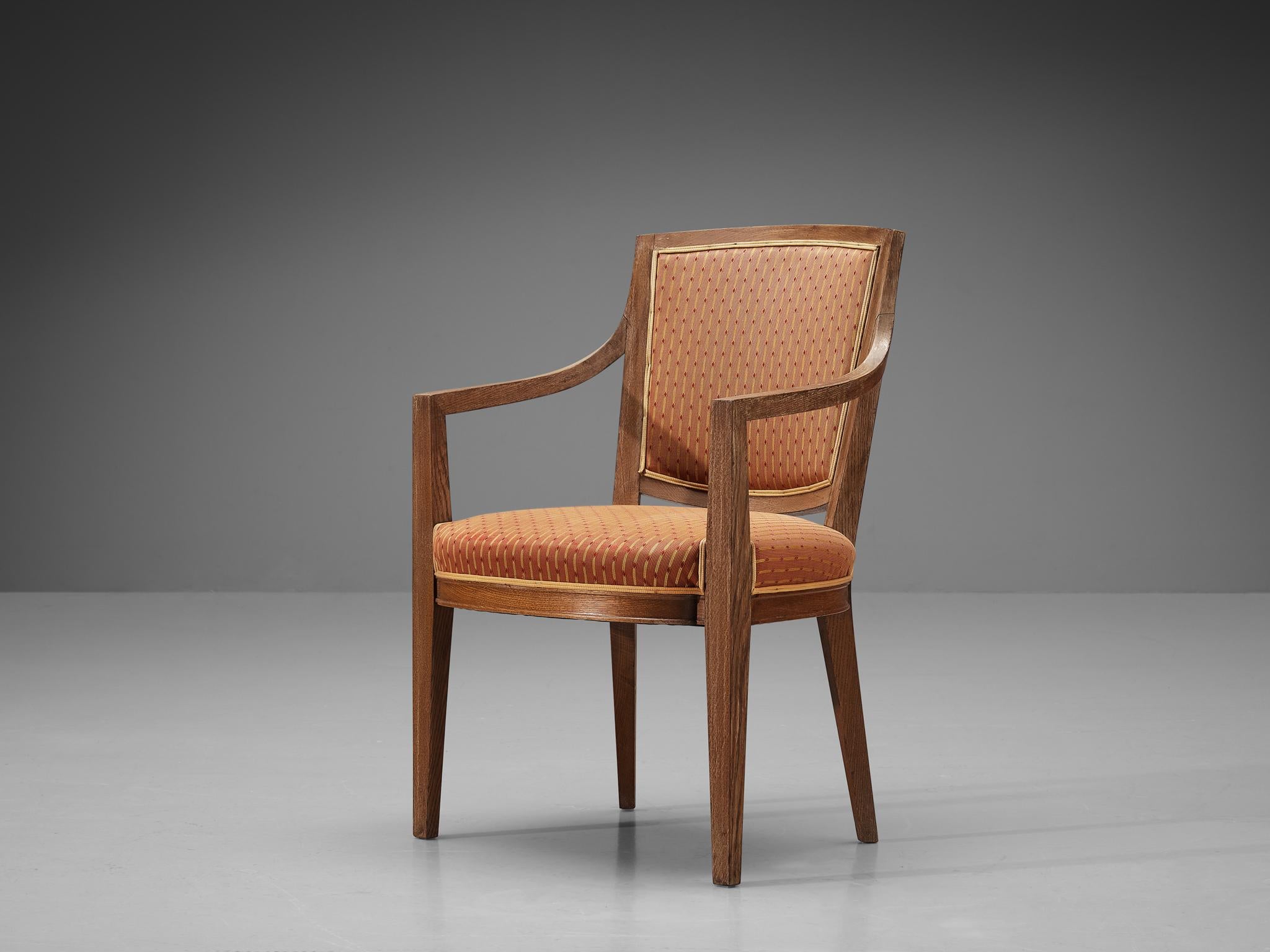 Dining chair, oak, fabric, France, 1940s

Late French Art Deco dining chair. This chair in solid oak features beautifully shaped sculptural legs and frame. Its armrests are rounded and contribute to its overall elegant design. The two vertical