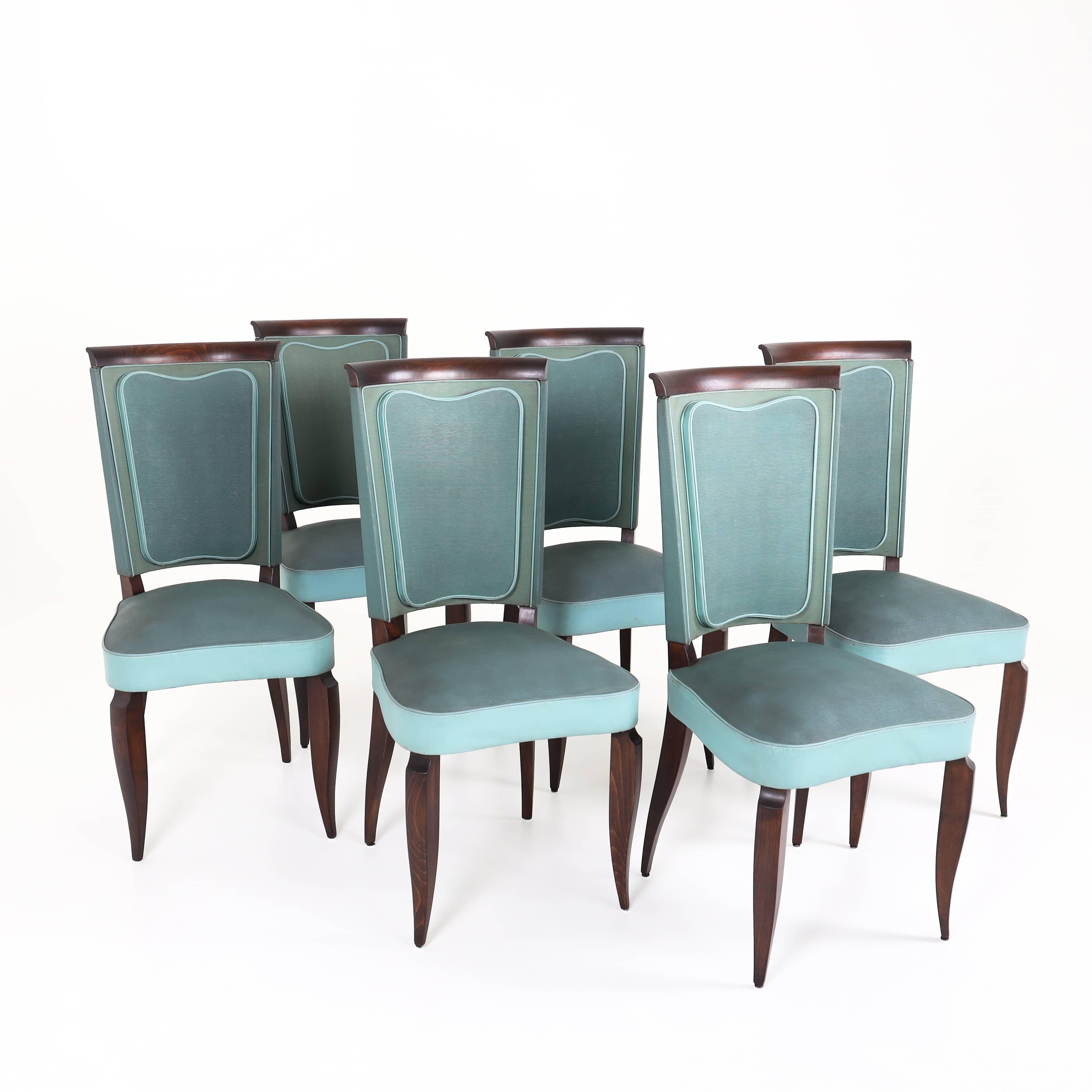 Set of six Art Deco dining chairs on elegant, curved legs with elaborately upholstered seats and backs. The wooden elements have been refurbished, the upholstery is in used, good condition.