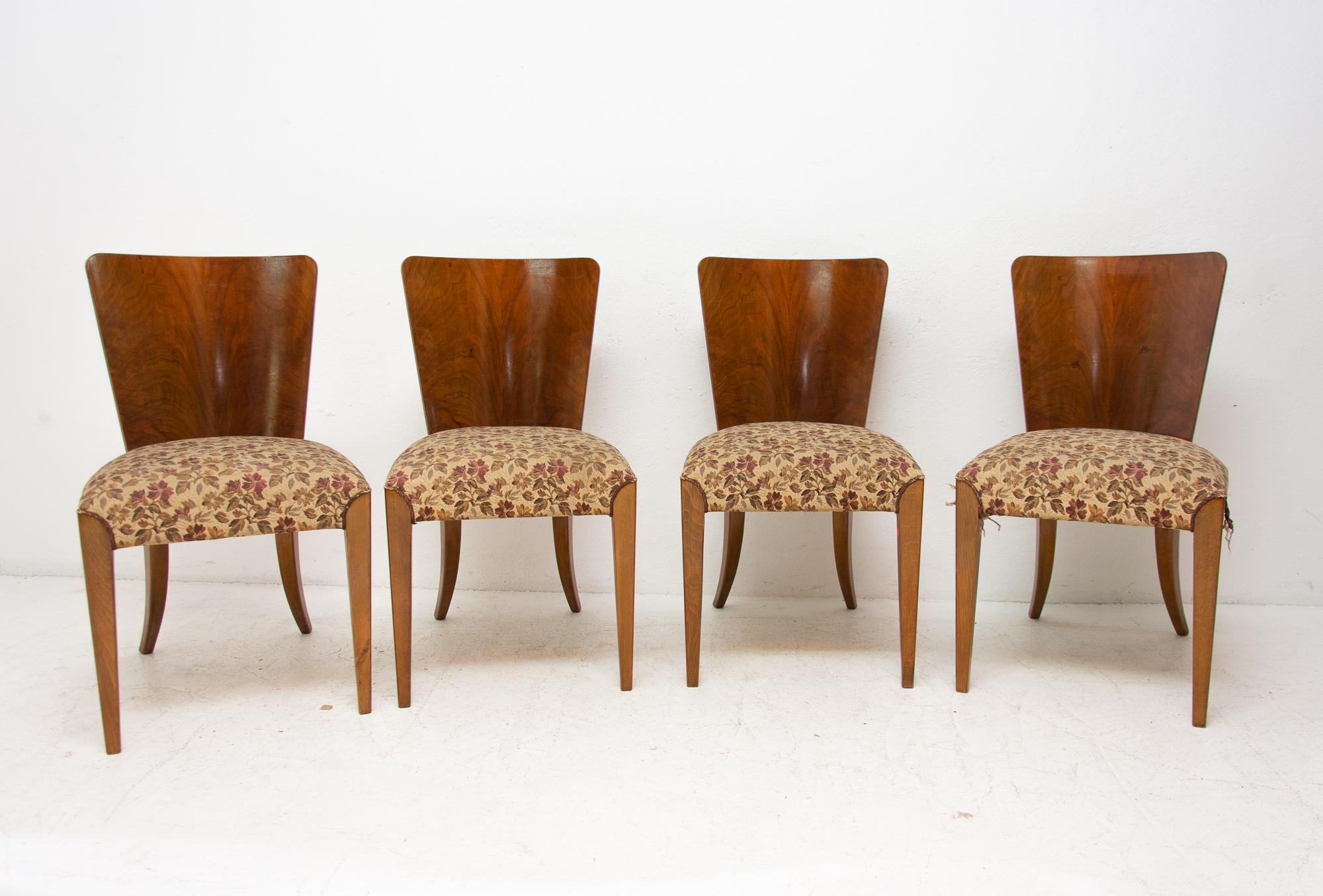 Dining chairs, catalog number H-214, designed by Jindrich Halabala in the 1930s, manufactured in ÚP Závody in the 1950s. It features walnut veneer and original upholstery. The chairs are in very good vintage condition. Price is for the set of 6.