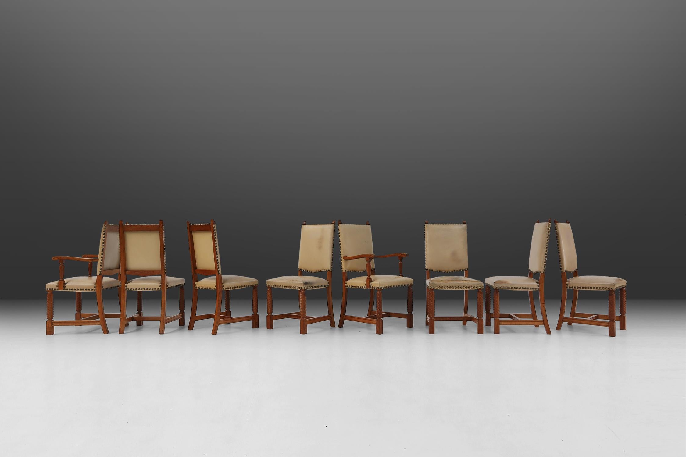 Belgian Art Deco dining room chairs made of solid oak and leather.
Beautiful designed dining room chairs that representing the Art Deco period of the 1940s. The robust chairs have turned legs and white leather seat and back with copper