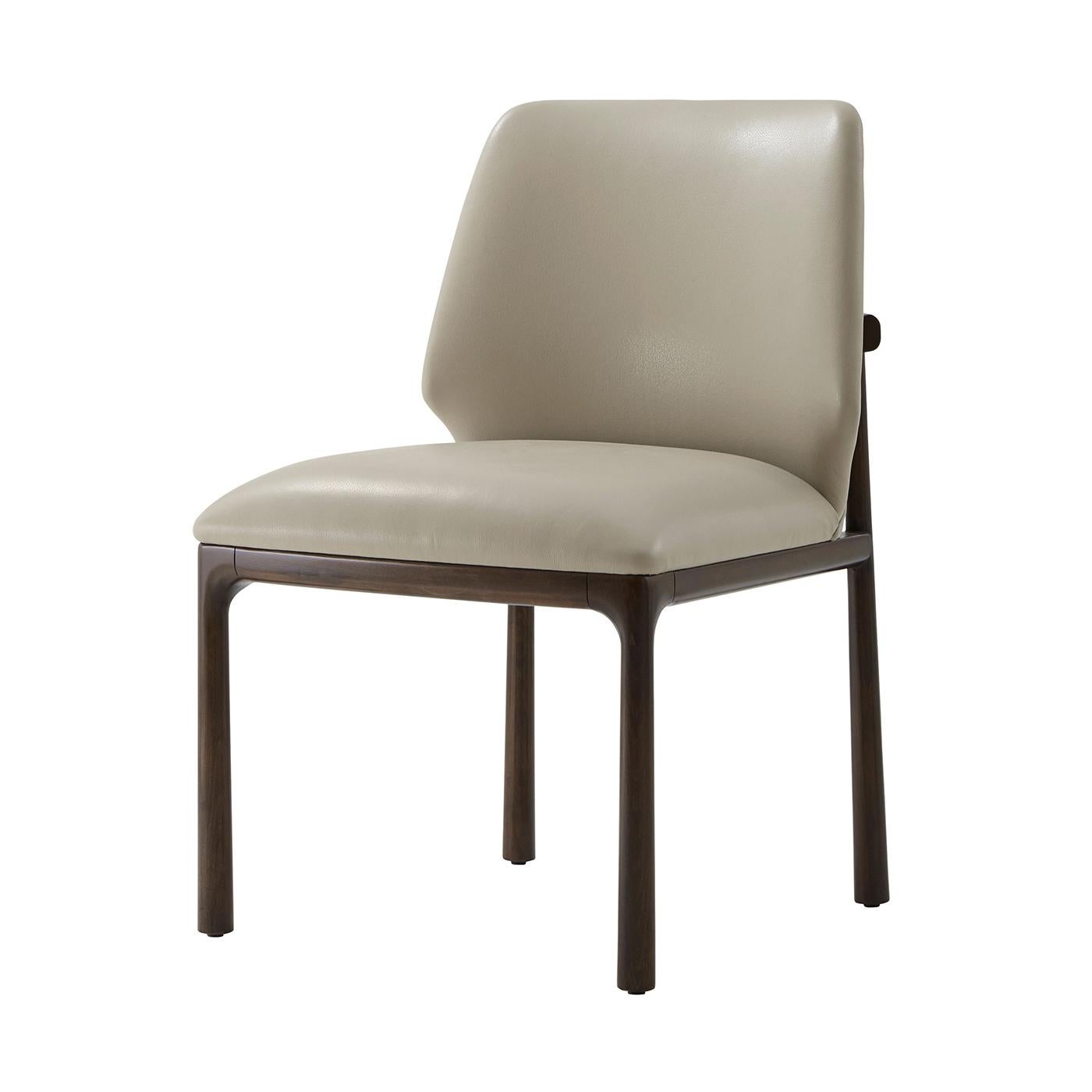 Combining timeless elegance with meticulous craftsmanship, this chair is a perfect addition to any sophisticated dining space.

Made from premium beech wood, showcasing gentle curves and a refined design. These chairs are covered in luxurious