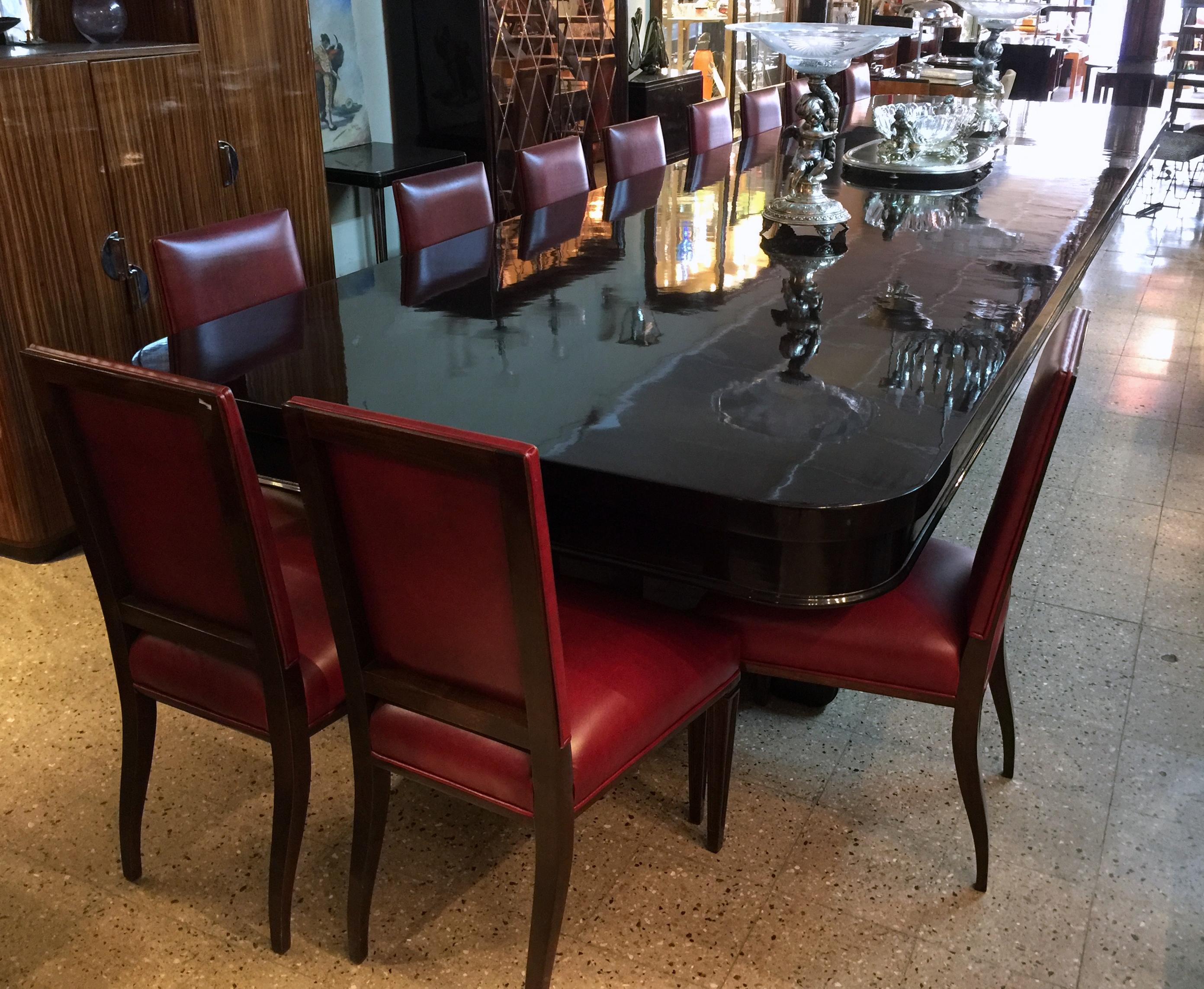 Table is Style Art Deco
Year 1930
French.
Wood is walnut root.
Finish: polyurethanic lacquer.
The top of the table is one piece of depth: 551 cm is amazing. 
In the table you can sit: 12 people very comfortable or 24 People is extraordinary and
