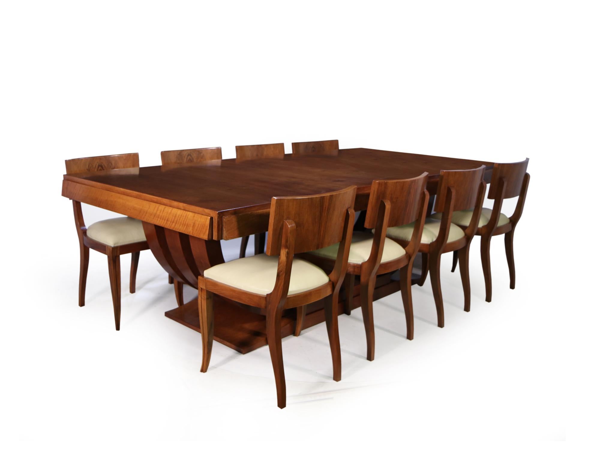 A very large dining table and eight dining chairs designed, and produced in Paris in the 1930’s, by Gouffe cabinetmakers this is where Jean Royere learnt his trade. The table will seat up to sixteen people with the leaves in and 10 without, when the