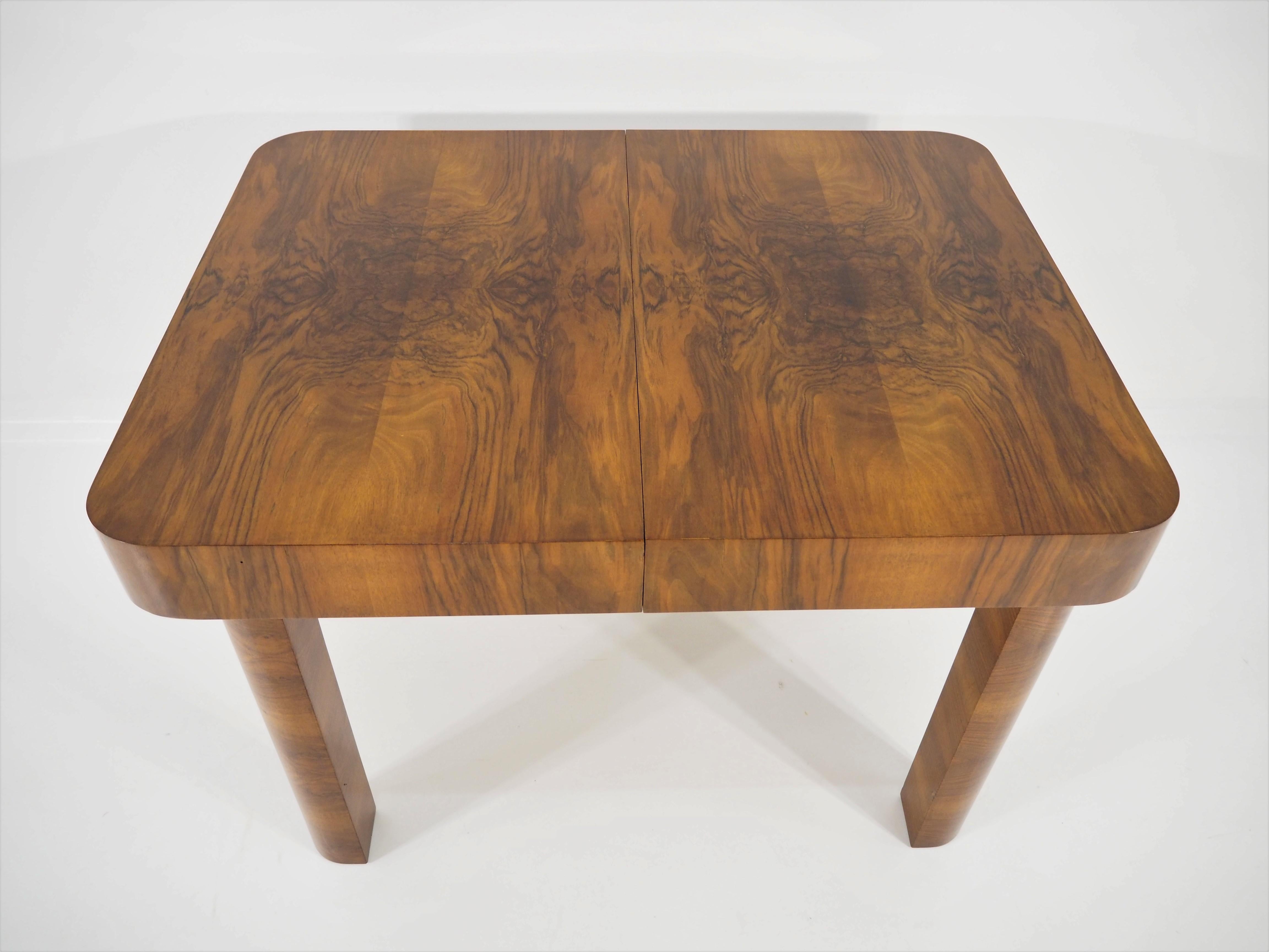 Art Deco walnut table. This table was designed and made in the circa 1940s in the former Czechoslovakia. The material is walnut veneer. Dimensions: Height 76 cm, length 110 cm, width 85 cm. Very good craftsmanship and fully functional. Unfolded