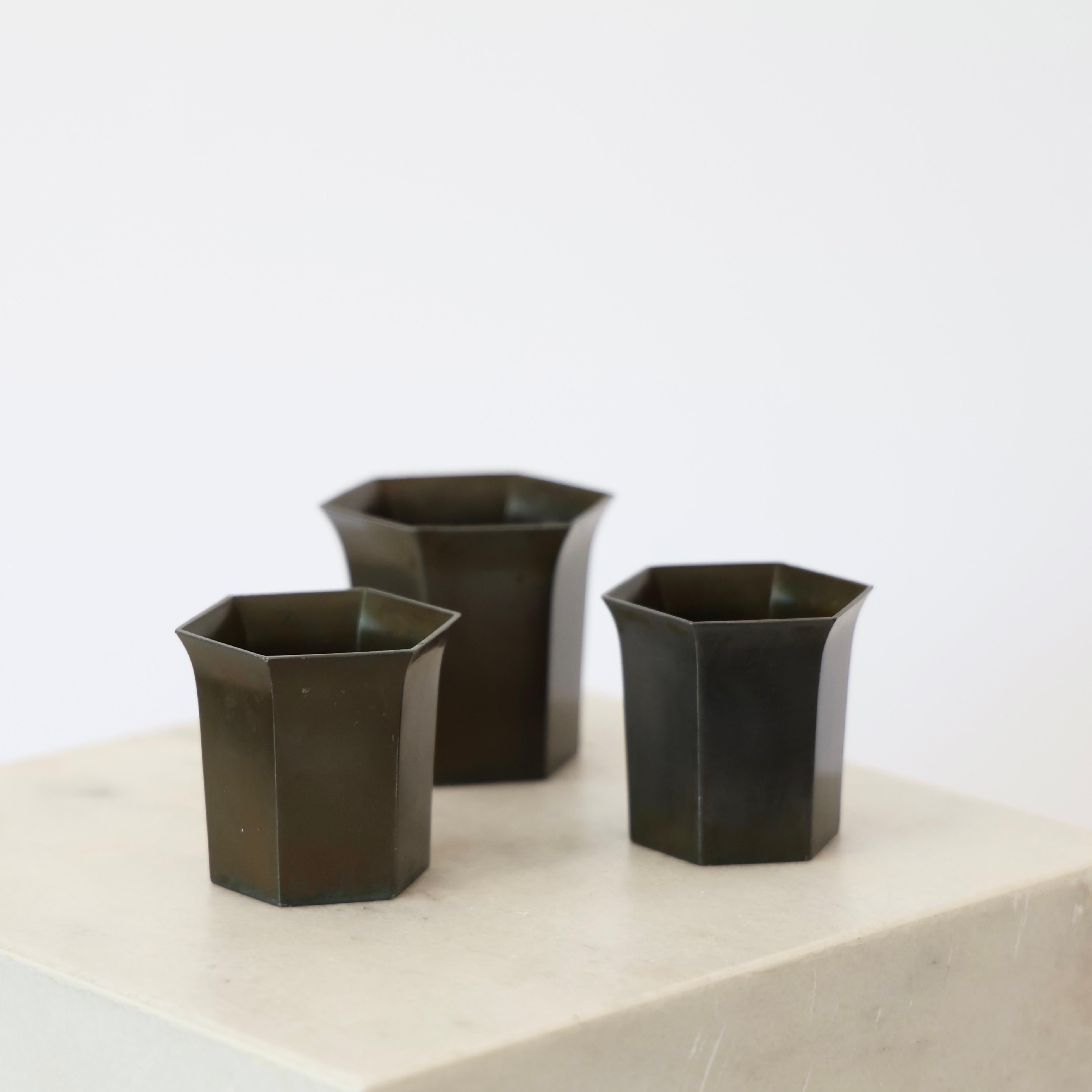 Elegant Trio of Art Deco Diskometal Goblets made by Just Andersen in the 1920s. 

* Set (3) of six-sided discometal vases  / goblets.
* Designer: Just Andersen
* Style: D22 & D23
* Year: 1918-1929
* Condition: Good vintage condition. Makers