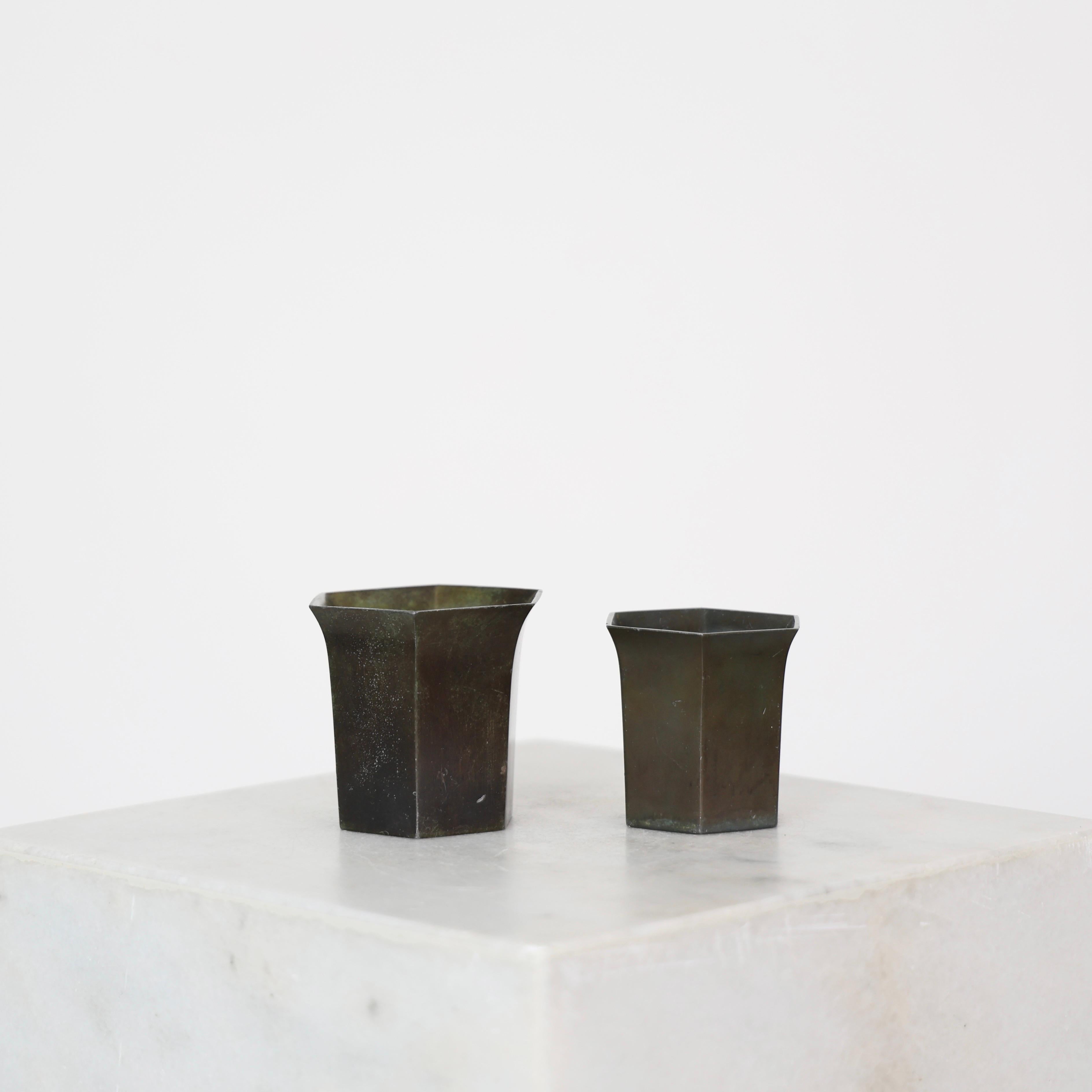 Elegant set of Art Deco Diskometal Goblets made by Just Andersen in the early 1920s. 

* Set (2) of hexagonal diskometal vases  / goblets.
* Designer: Just Andersen
* Style: D22 & D23
* Year: 1918-1929
* Condition: Good vintage condition. Makers