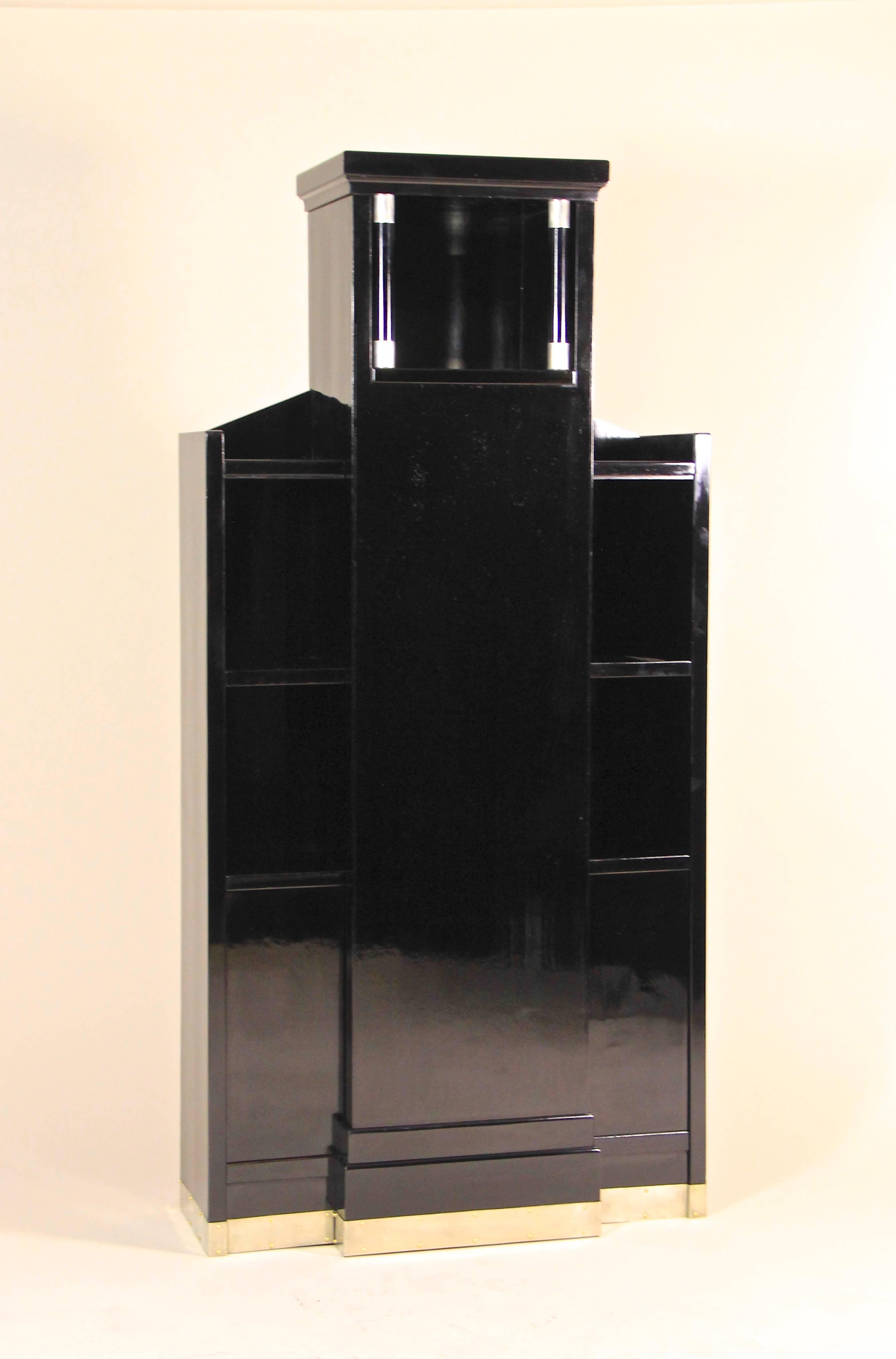 Rare design Art Deco display cabinet from the early 20th century in Austria. This architectural cabinet was built circa 1920 and shows the transition from Art Nouveau to the early Art Deco period in perfection. The unusual lines, reminding on a