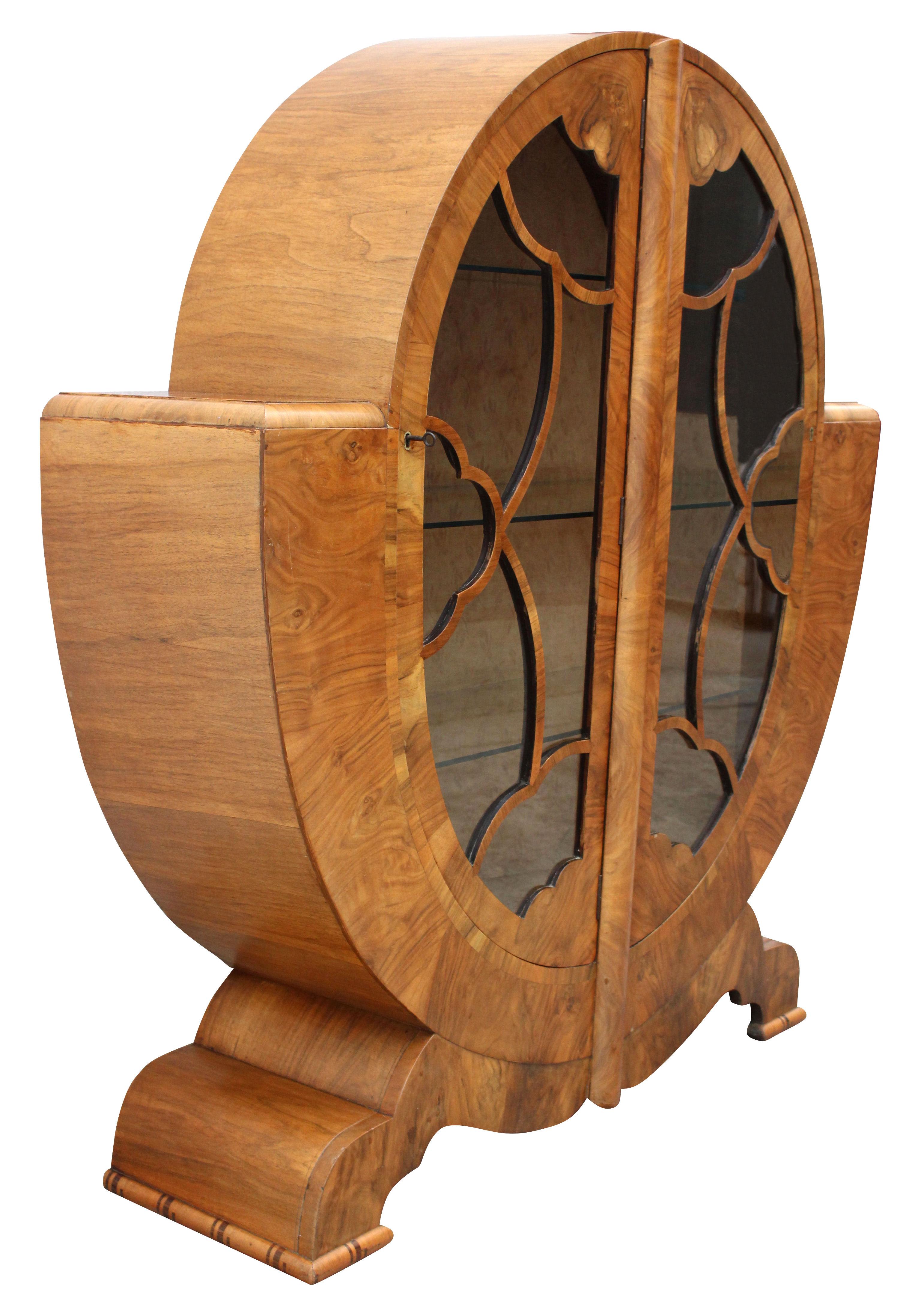 Impressively stylish and genuinely rare design is this superb 1930's English Art Deco Display cabinet. This beautiful cabinet is veneered in walnut which has the most glorious patterning to the grain and retains a honey tone in colouring. The