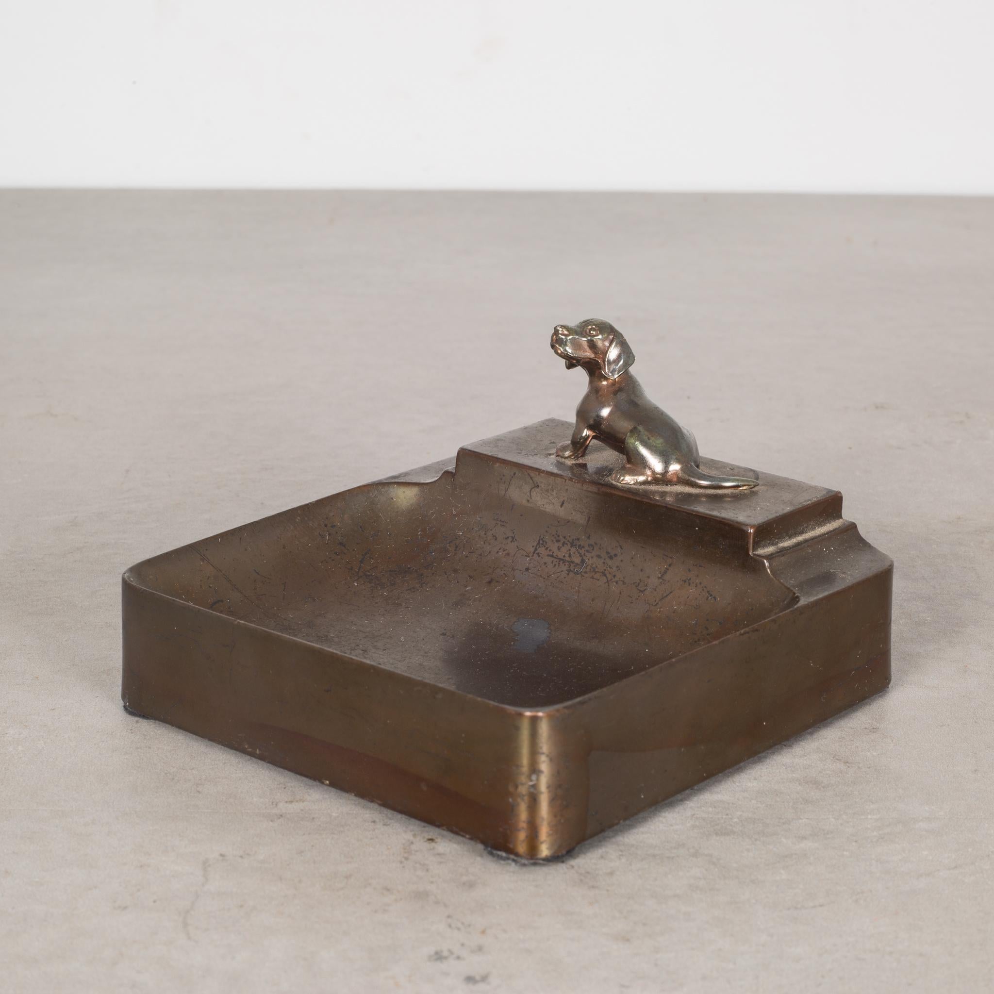 About

This is an original Art Deco brass dog coin tray. This piece has retained its original finish.

 Creator: unknown.
Date of manufacture: circa 1930s.
Materials and techniques: brass.
Condition: good. Wear consistent with age and