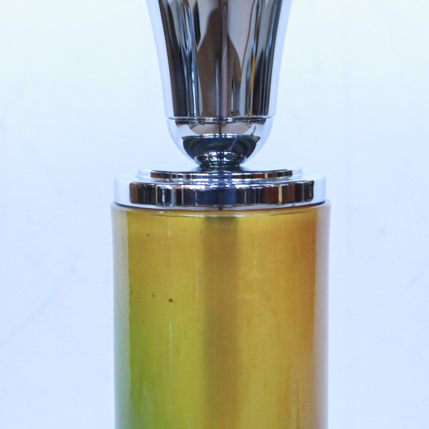 An Art Deco table lamp with chromed metal dome shade. Original green to yellow gradient tone, reeded bakelite stem over a chrome metal base. Green bakelite finial to top. Some replacement parts.

Fully refurbished, re-wired and re-chromed. Some