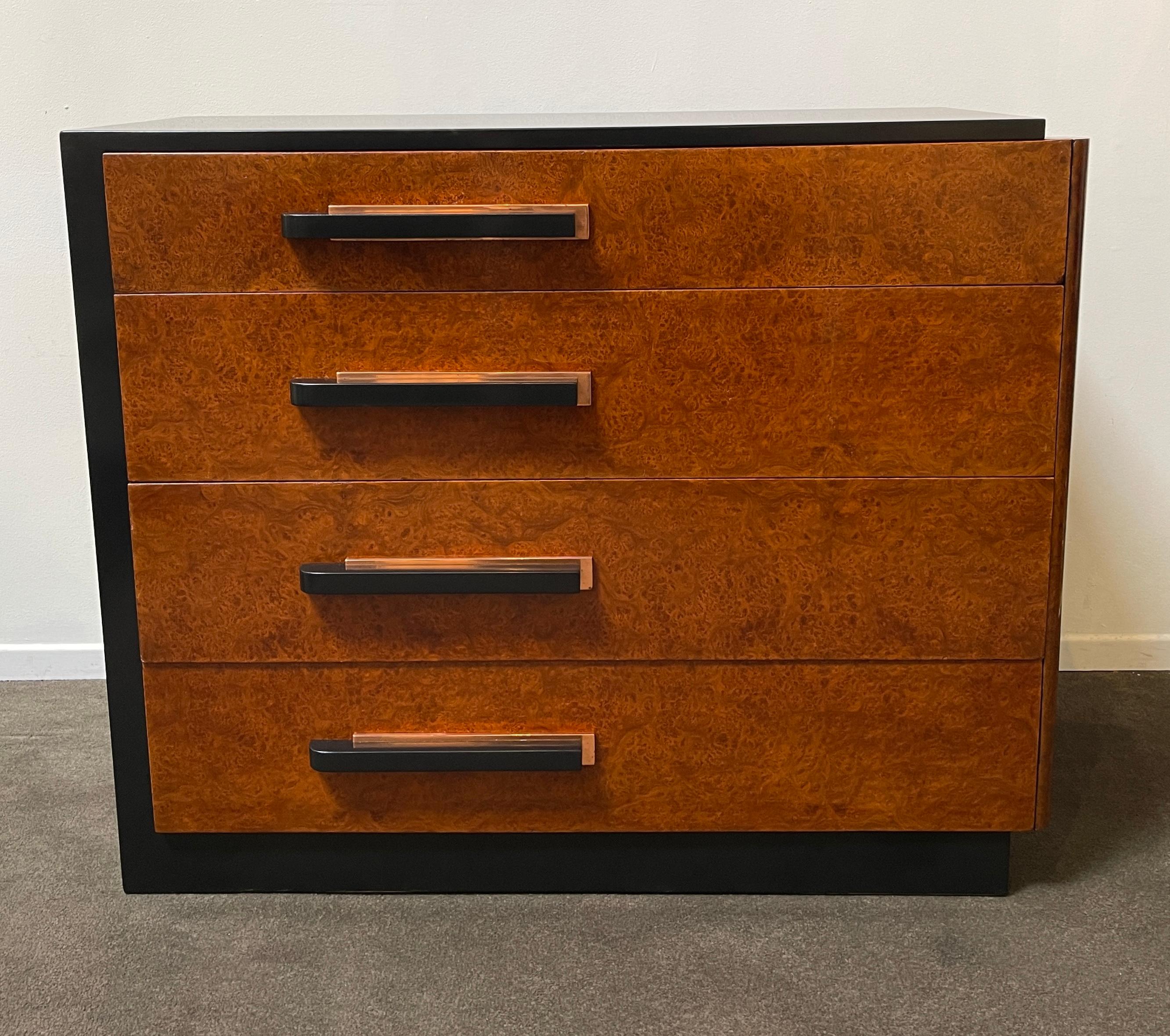Beautiful and rare dresser designed by important art deco designer Donald Deskey for Widdicomb, circa 1935. This 4 drawer chest is in excellent condition. The finish has been expertly restored. The back plate of the handles are made with copper.