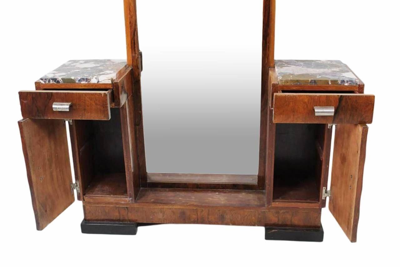 Vanité Art-Déco de style Donald Deskey, miroir en pied. Cette superbe pièce en palissandre possède un miroir biseauté sur toute la longueur, ainsi qu'un petit meuble de chaque côté, chacun étant doté d'un tiroir et d'un petit meuble. Chaque meuble