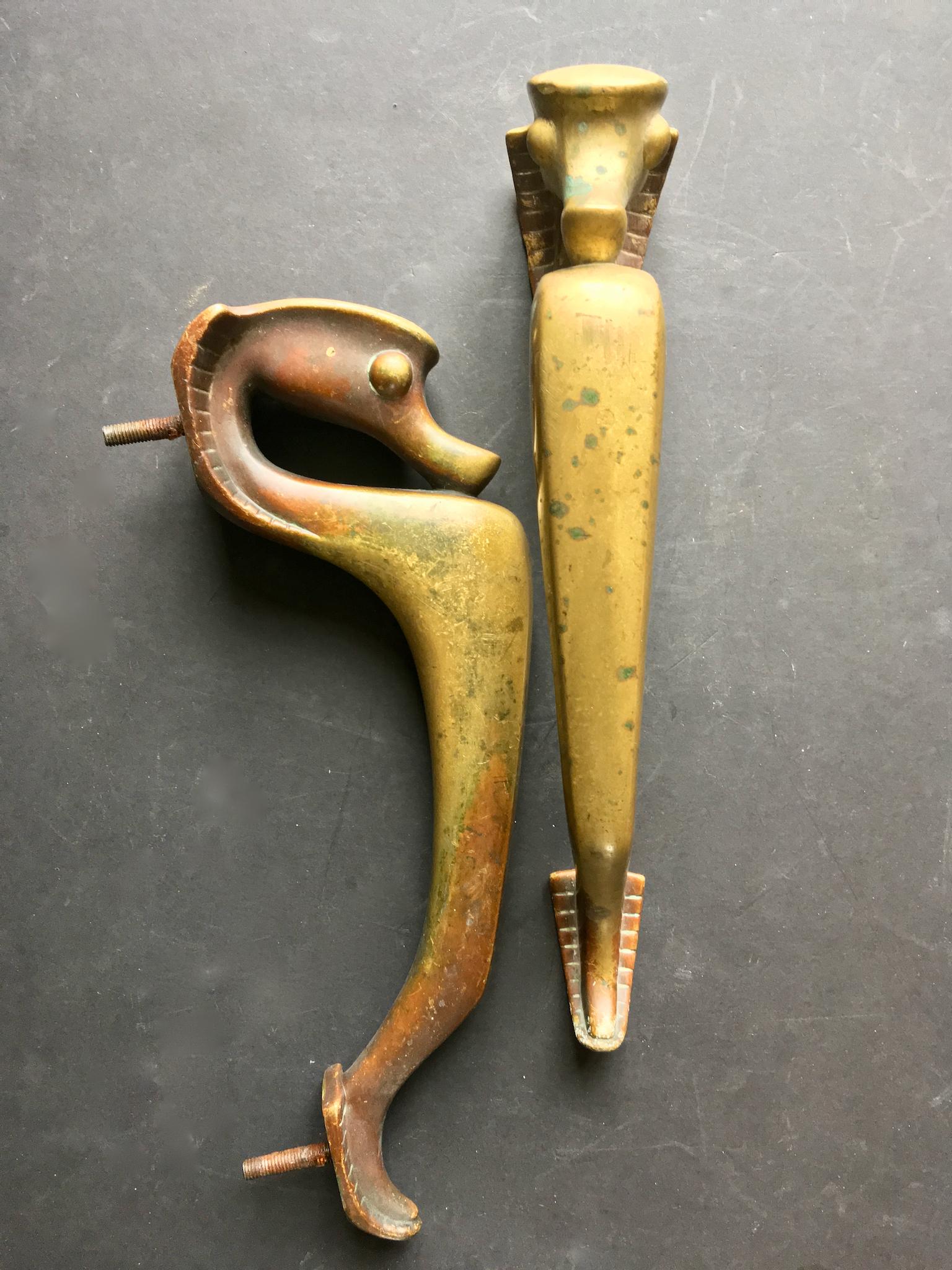 Pair of large Art Deco door handles in the shape of seahorses. These pieces are European, probably Austrian or German, early to mid-20th century, unsigned.

Unusual and heavy pieces with lots of age-related patina to the brass or bronze. We have