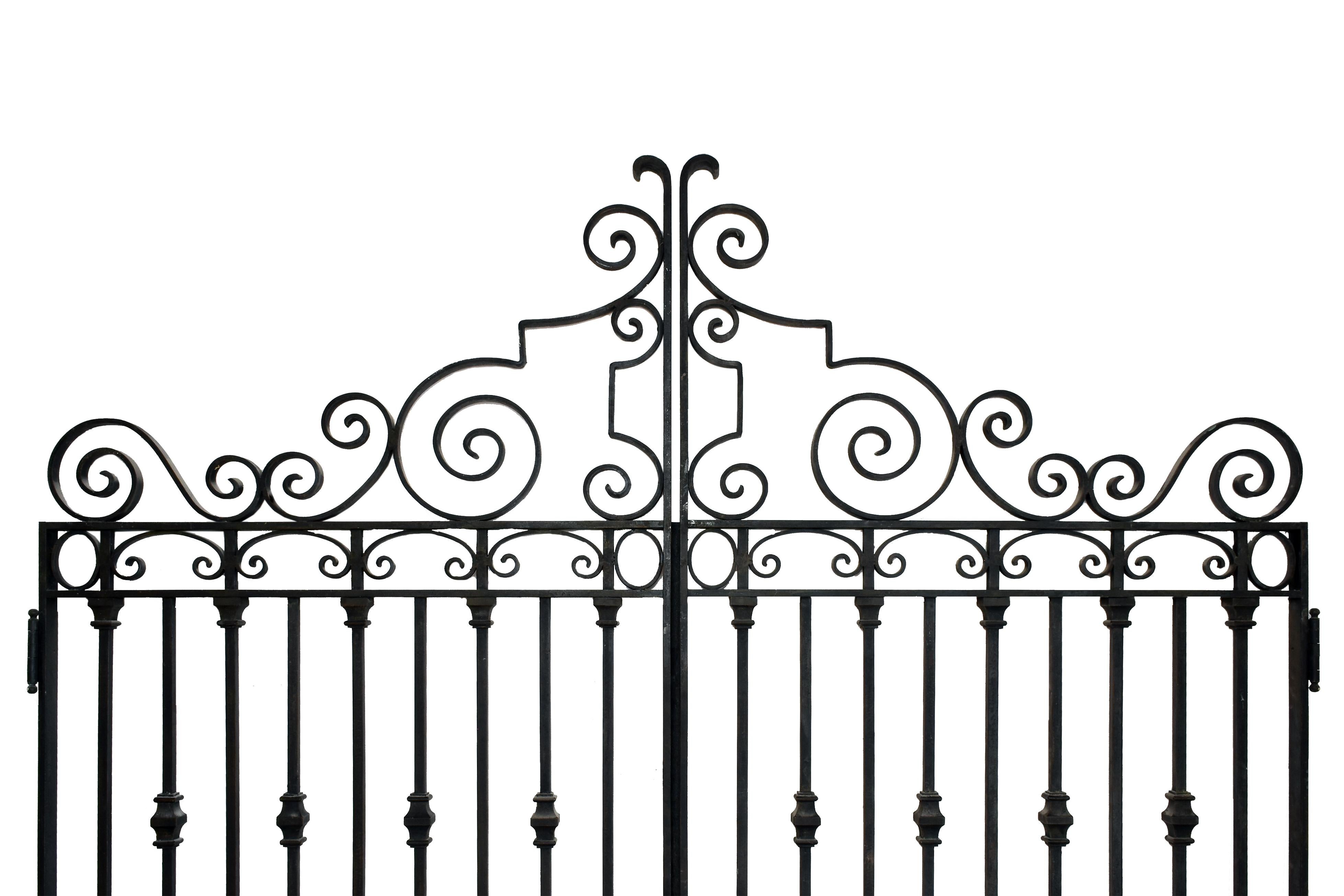 This door set could be used as a grand garden entry or a private pedestrian gate. They are a simple Art Deco design with geometric, curved, and beaded elements. The lower vertical rods feature alternating twisted wrought iron and simple capped