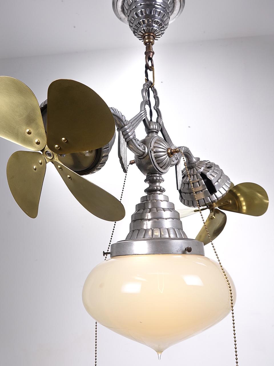 This is a high style aluminum Deco 1930s Fan-N-Lite made in Chicago. They are very rare and you may never see another example. The onion shaped globe has a large 10 inch diameter. Its hand blown Vaseline glass. The 2 four blade brass fans also have