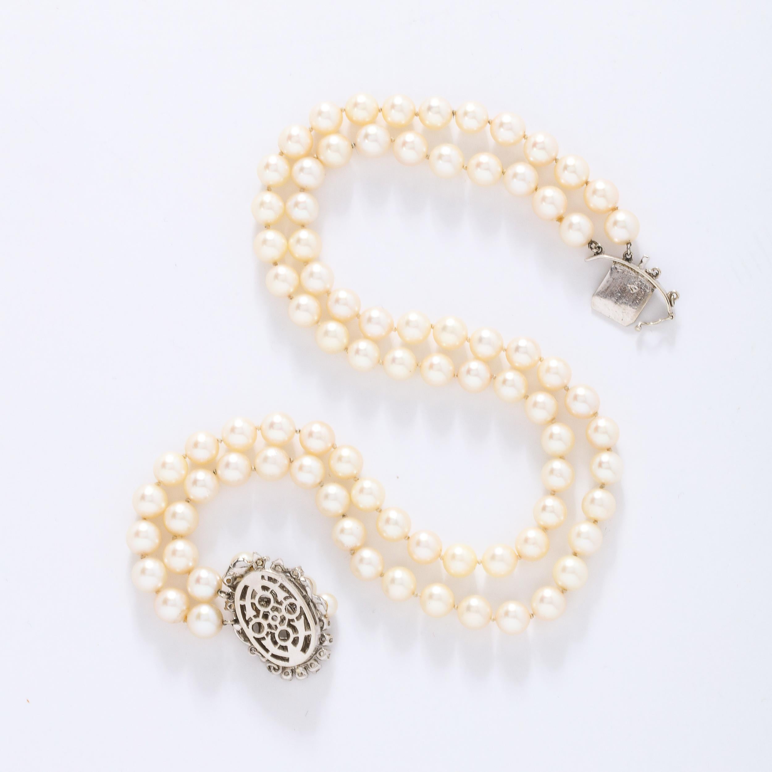 Art Deco Double Strand Pearl Necklace with 14kt Gold, Diamond and Pearl Clasp In Excellent Condition For Sale In New York, NY