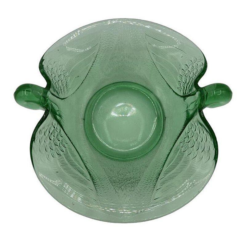 Handcrafted Ring Tray Bowl made with elegant green Uranium glass by Fenton Art Glass Company. The design features a pair of graceful swans, carefully molded to create a stunning focal point that exudes timeless charm. Each swan is detailed with