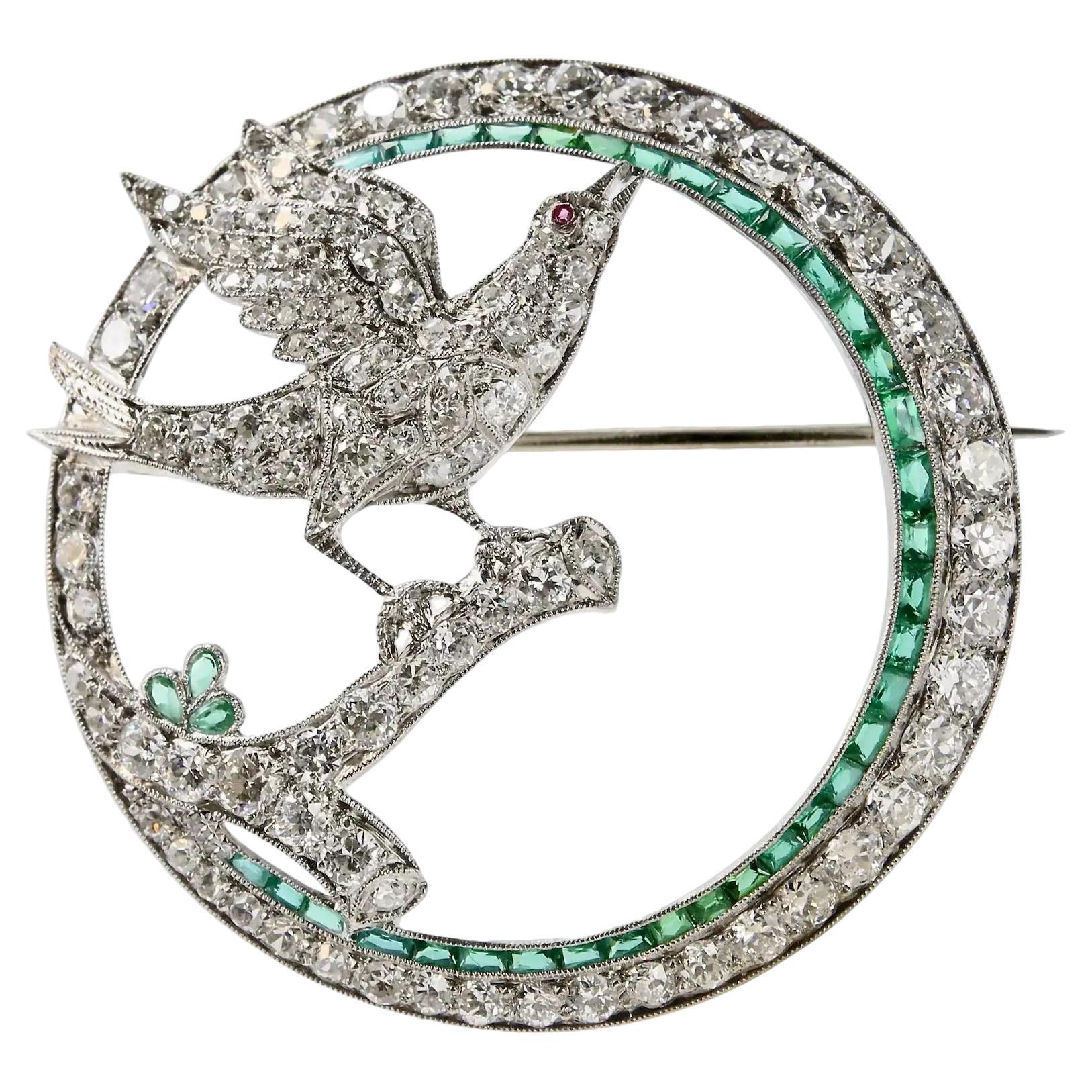 Art Deco Dove with Olive Branch Diamond and Emerald Circle Brooch in Platinum For Sale