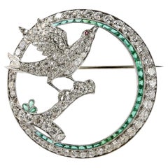Art Deco Dove with Olive Branch Diamond and Emerald Circle Brooch in Platinum