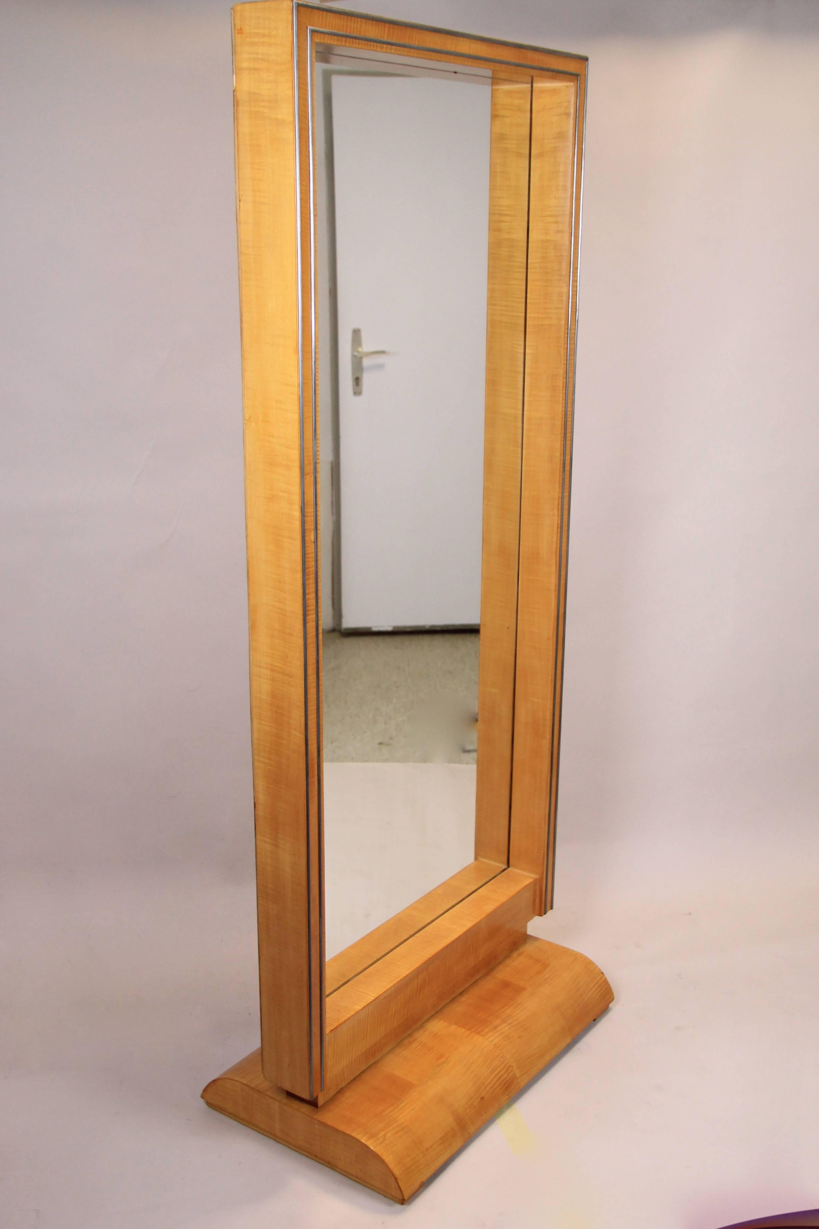 From Austria circa 1930 comes this large freestanding Art Deco Dressing Mirror. The 20th century full-length mirror shows a fantastic timeless design, processed of fine maple wood. The straight shaped broad frame is adorned by two parallel running