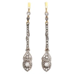 Art Deco drop gold earrings with diamonds, circa 1925.