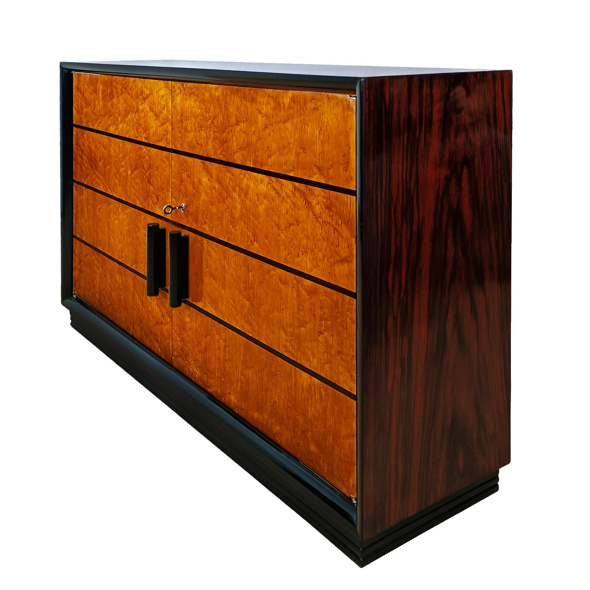 Art Deco narrow dry bar or cabinet, with rosewood and bird’s eye maple veneer, black lacquered base, frame and handles, inlaid doors, french polish finishing.

Italy circa 1930