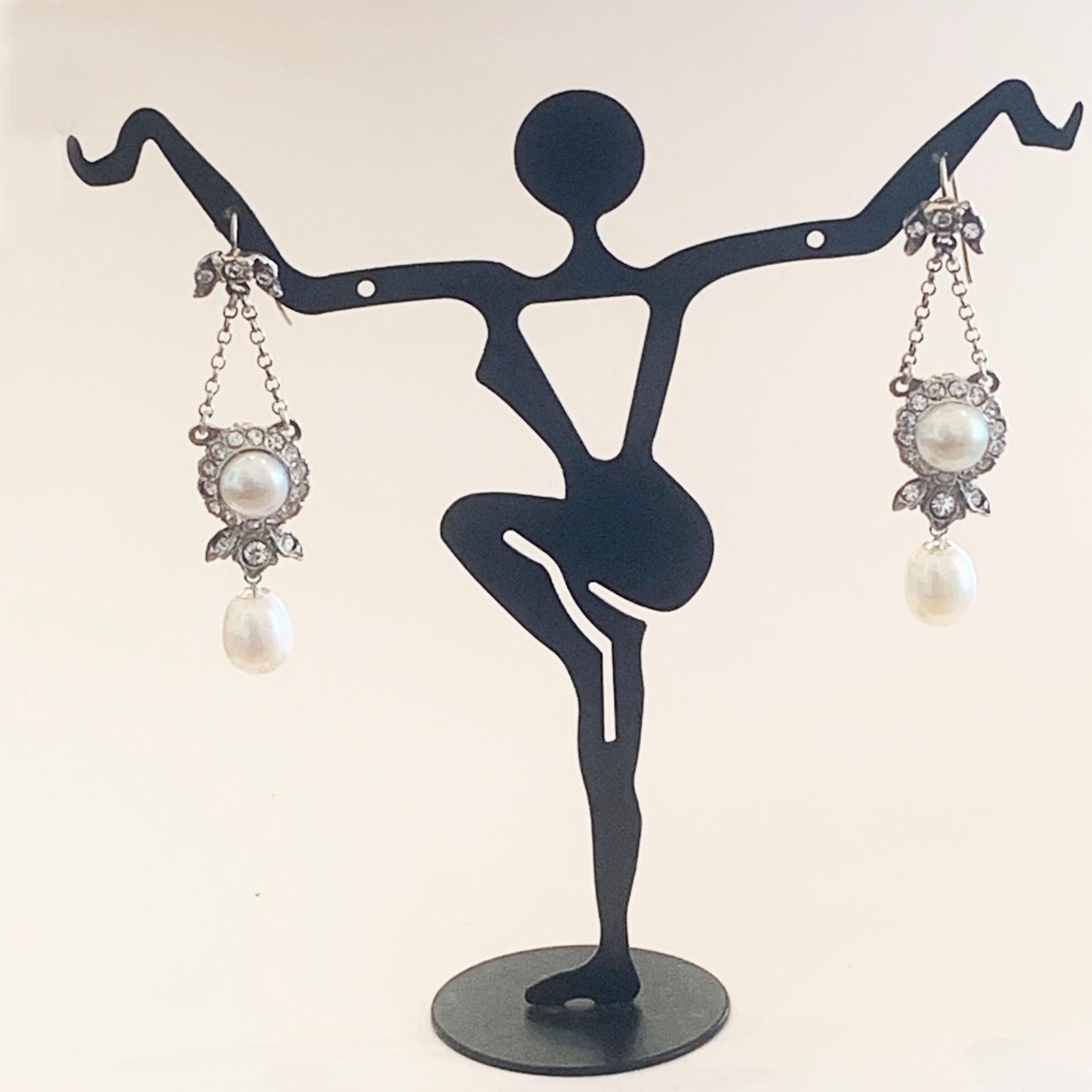 Fine Art Deco Earrings with 9ct Gold loops for the ear, Sterling silver body, set with mine cut Crystal and Cultured Pearls. The upper post section supports the lower component that swings on 2 silver chains, and another lower pearl that swings