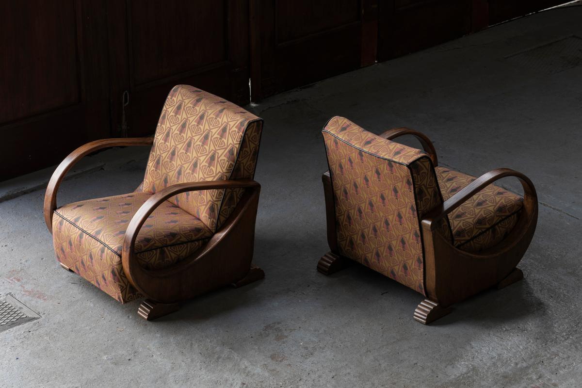 Set of 2 easy chairs from de Amsterdamse school, designed and produced in Holland during the 1930’s. Made of stained bentwood combined with original art deco pattern upholstery. Exquisite shapes which make these pieces work well in a living room,