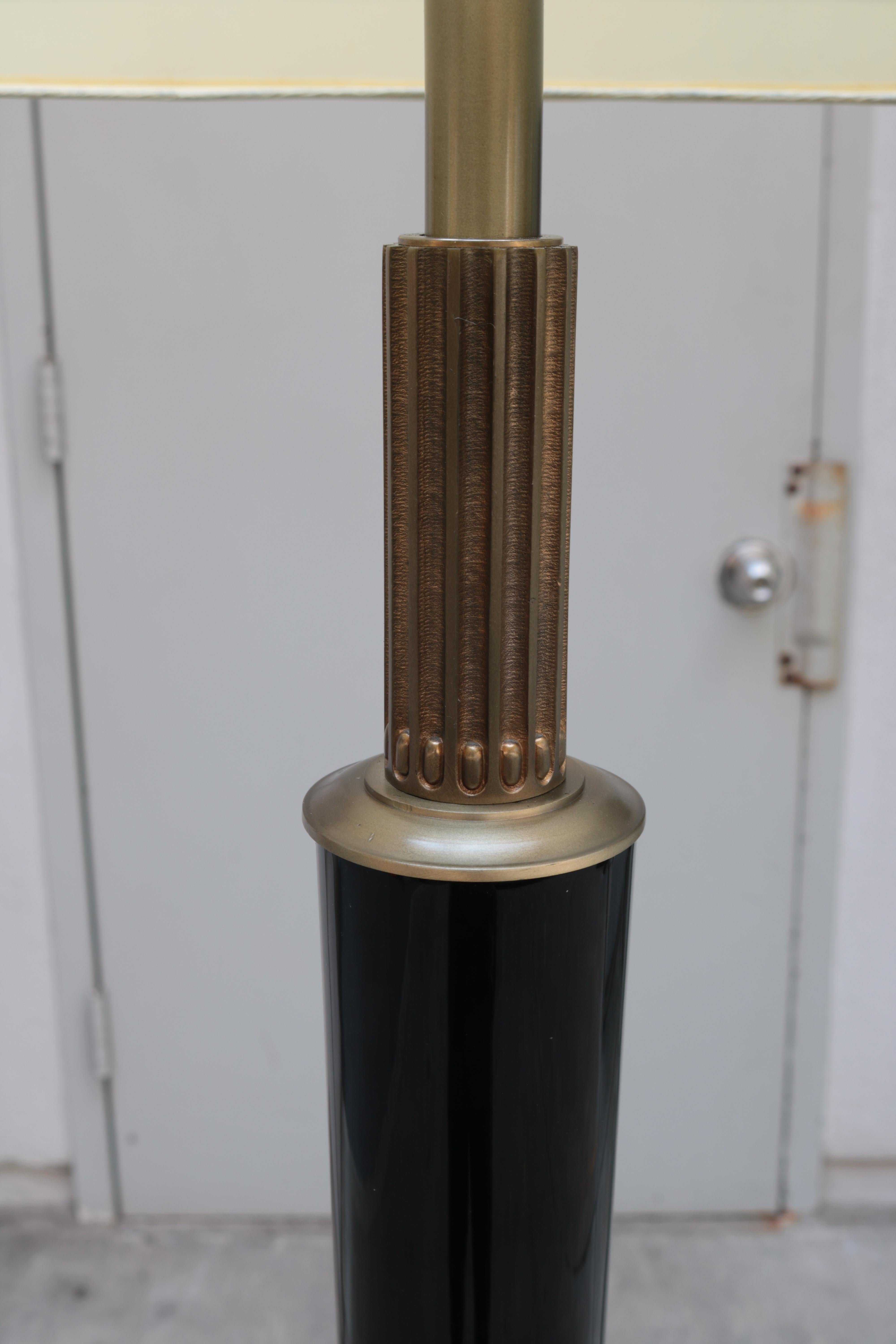 Art Deco ebonized floor lamp by H. Boinot.
Black lacquer with patinated bronze details.
Signed H. Boinot.