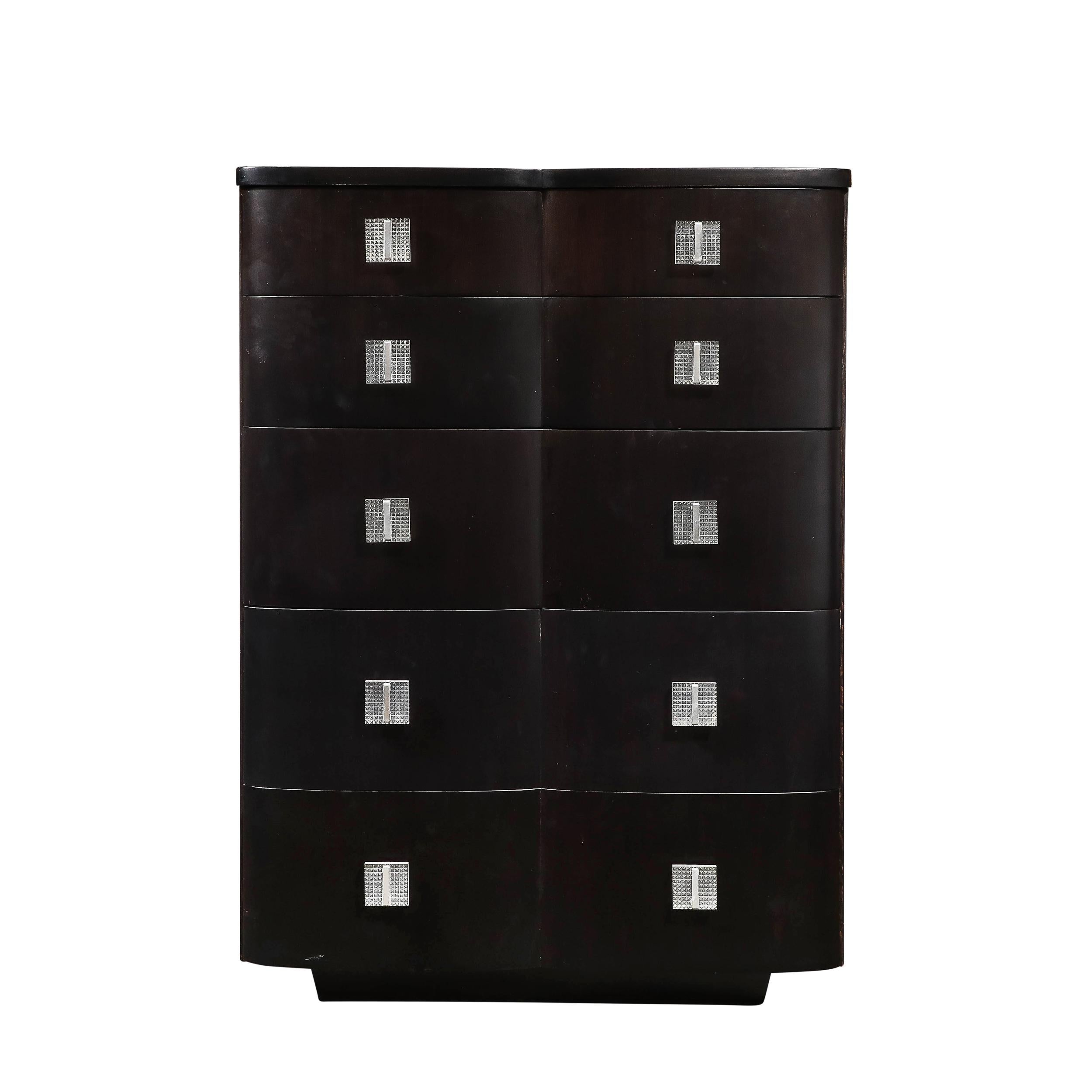 This exquisite Art Deco ebonized walnut high chest, dating from circa 1940, is a striking example of American craftsmanship from the period. The deep, rich finish of the ebonized walnut exudes elegance and sophistication, while the molded Lucite