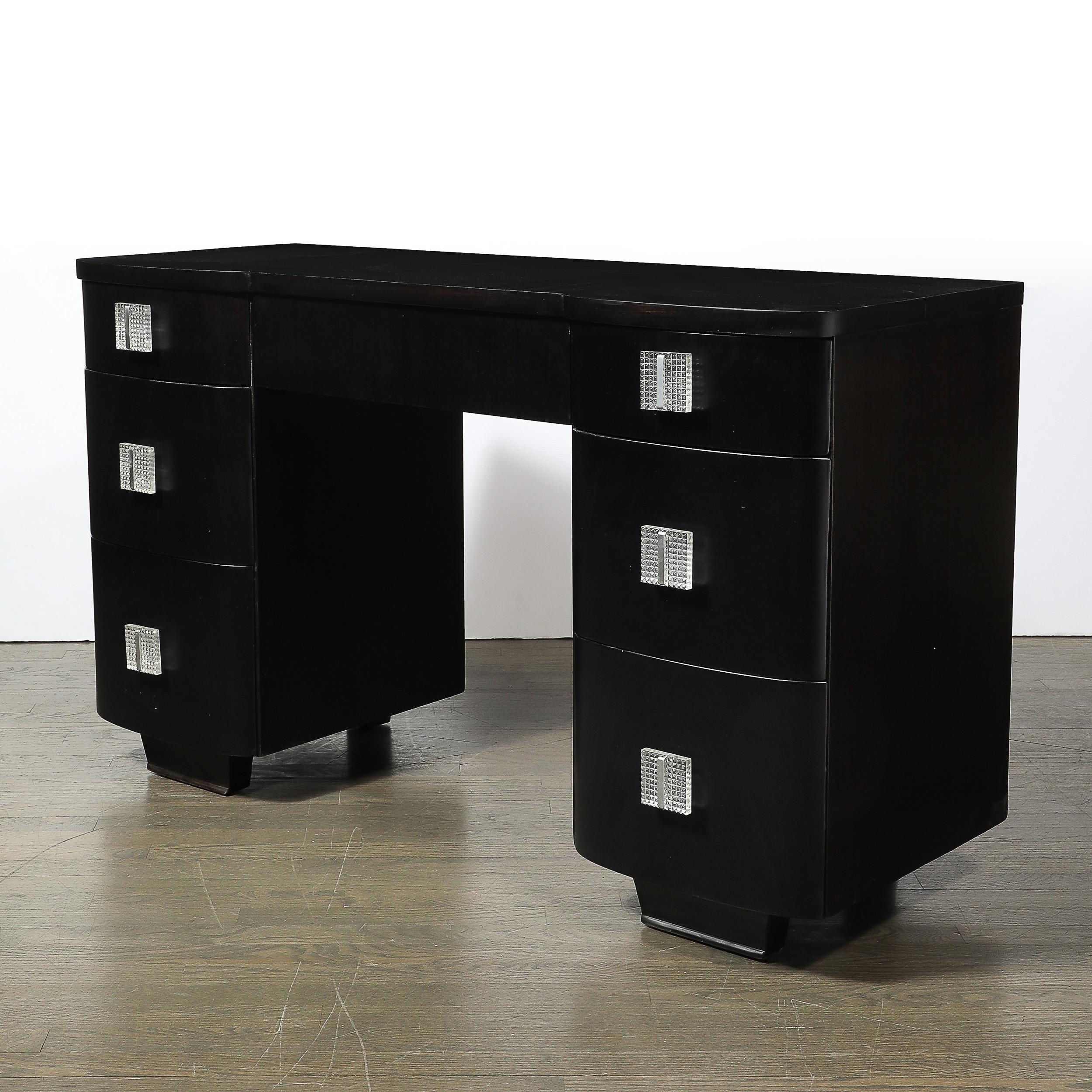 Elevate your interior with an exquisite piece that embodies the pinnacle of sophistication and elegance: the Art Deco Ebonized Walnut Vanity Desk with Molded Lucite Pulls, American, circa 1940. This stunning vanity desk is a perfect embodiment of
