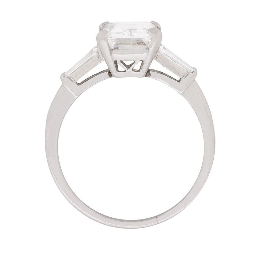 This antique, circa 1920s emerald cut diamond solitaire engagement ring is presented in platinum, showcasing an enviable, EDR Certified, 3.83 carat, emerald cut diamond in true Art Deco style. 
This spectacular diamond is corner set within an