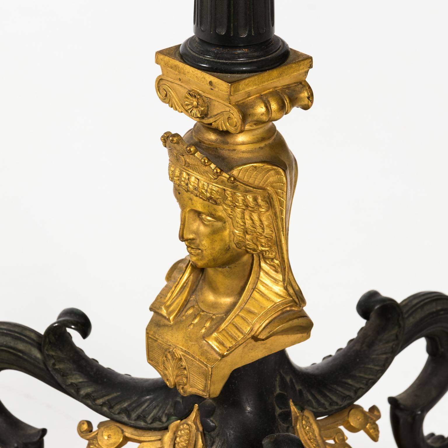 Bronze Art Deco Egyptian Revival style base that features a detailed sphynx, snakes, birds, and griffin legs, circa 1920.
 