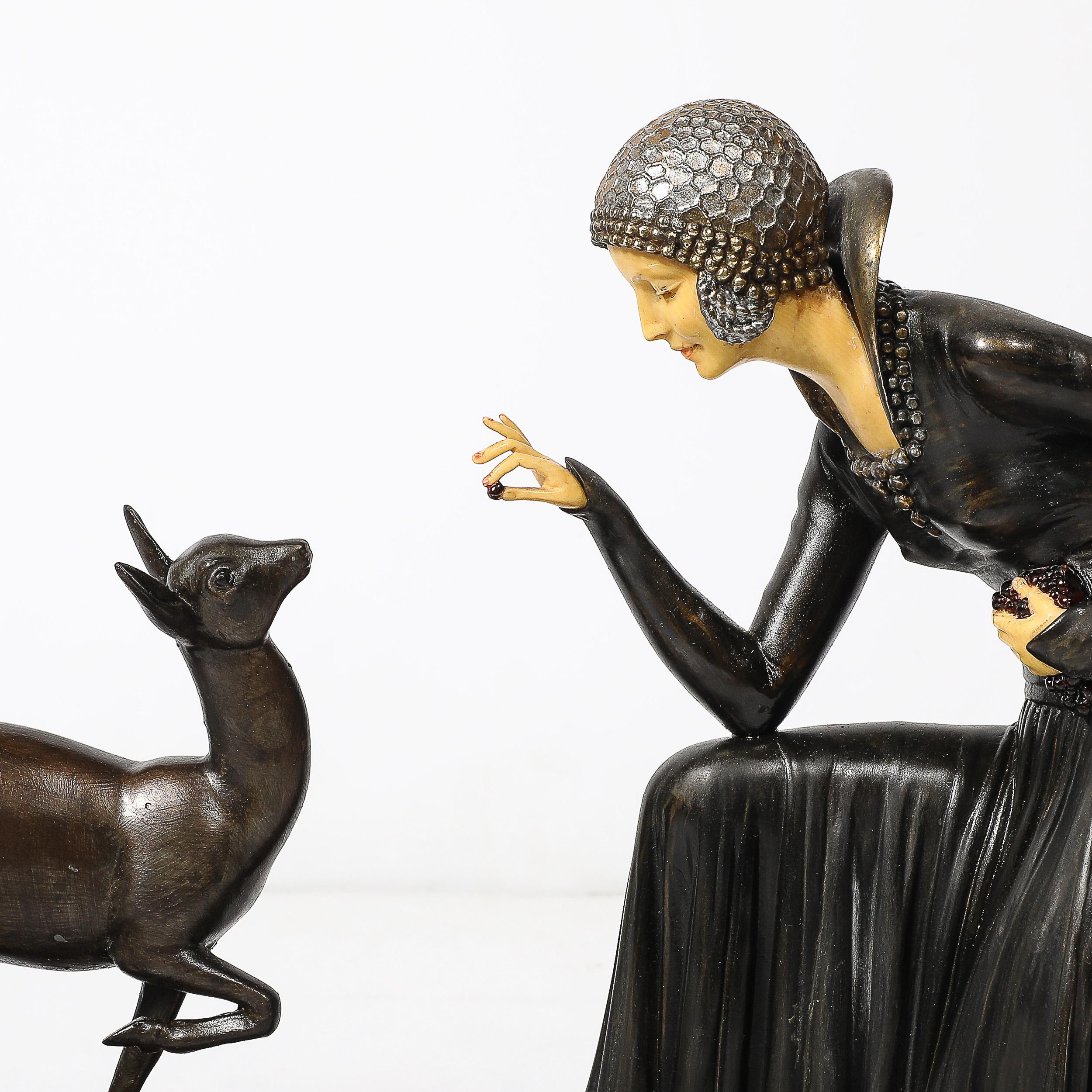 This exquisite Art Deco sculpture, titled “Élégante Aux Biches,” is an iconic work by Demétre Chiparus, one of the most celebrated artists of the period. Cast in detailed bronze and set atop an alabaster base, the piece depicts a graceful,