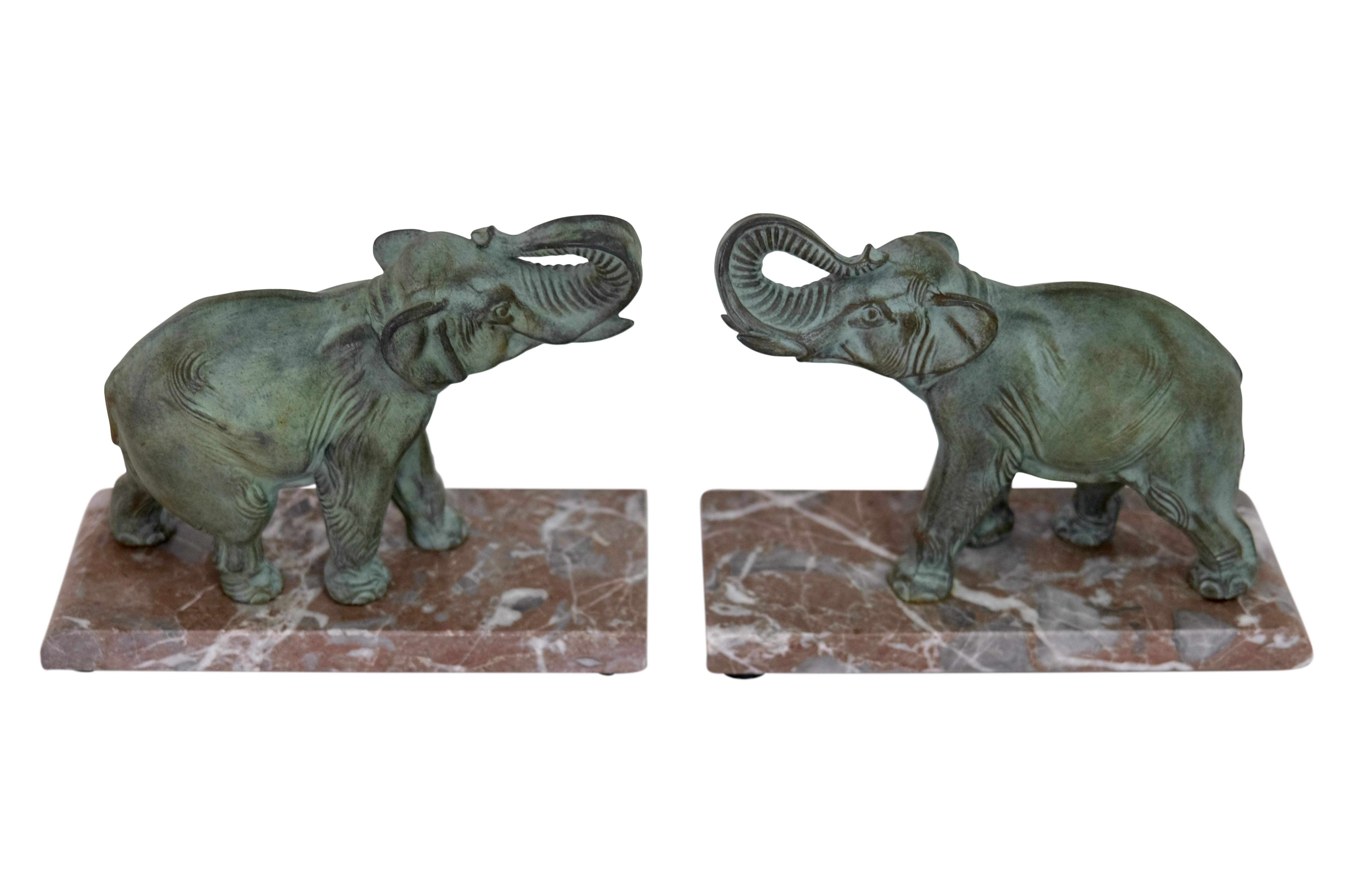 Elephant bookends with raised trunk

Pair of bookends
Elephants with raised trunk
Spelter with original patina
Marble base

Original Art Deco, France 1930s

Dimensions (per object):
Width: 22.5 cm
Height: 18 cm
Depth: 9 cm