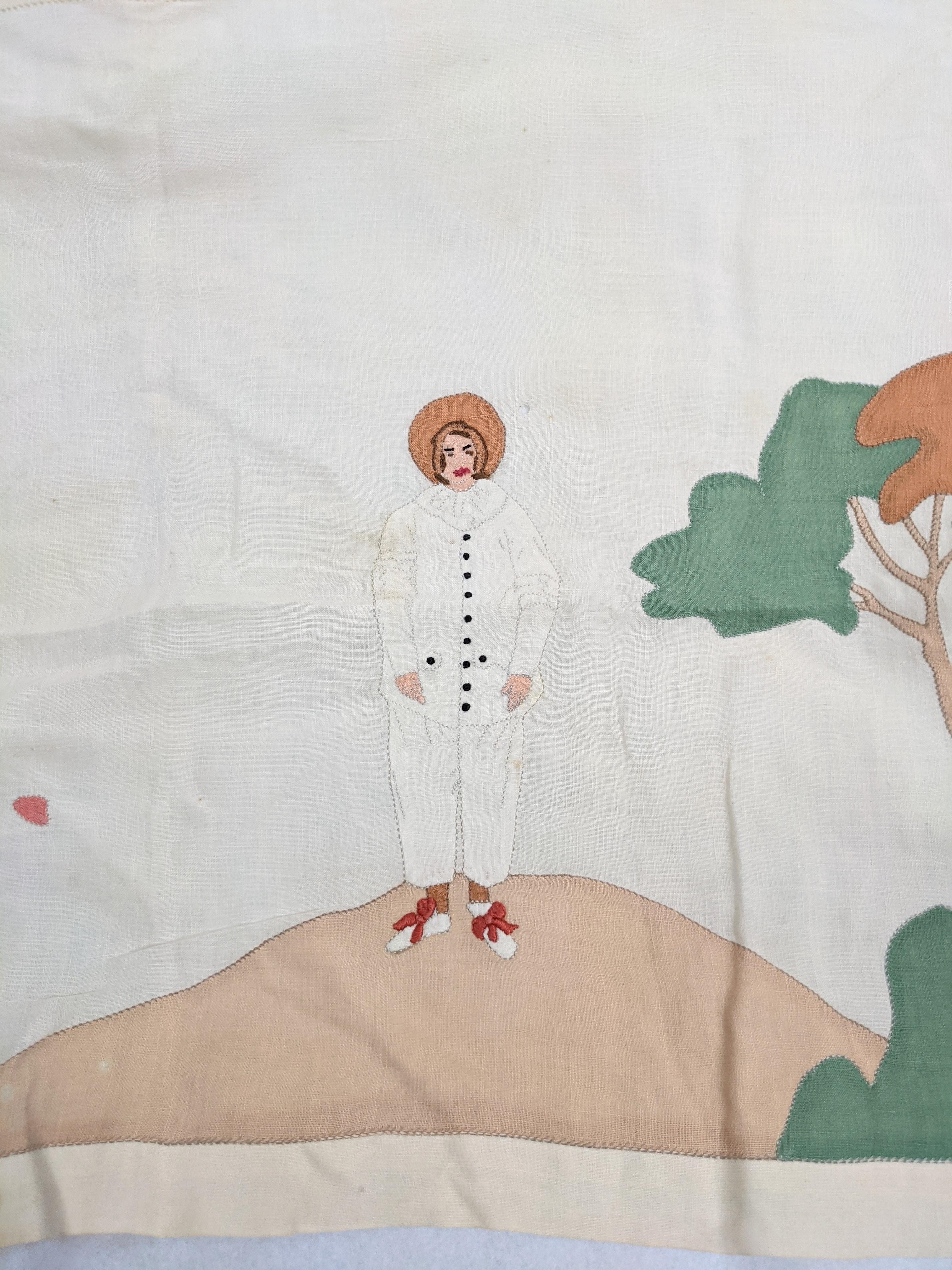 Art Deco Embroidered and appliqued mat. Watteau subject matter on fine cotton batiste of a lone Pierrot on a hill rendered in vari colored cotton batiste appliques. Beautiful detailing and would be great mounted under glass in a tray or in a