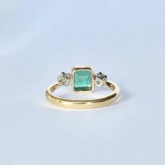 Art Deco Emerald and Diamond 18 Carat Gold Three-Stone Ring