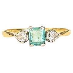 Art Deco Emerald and Diamond 18 Carat Gold Three-Stone Ring