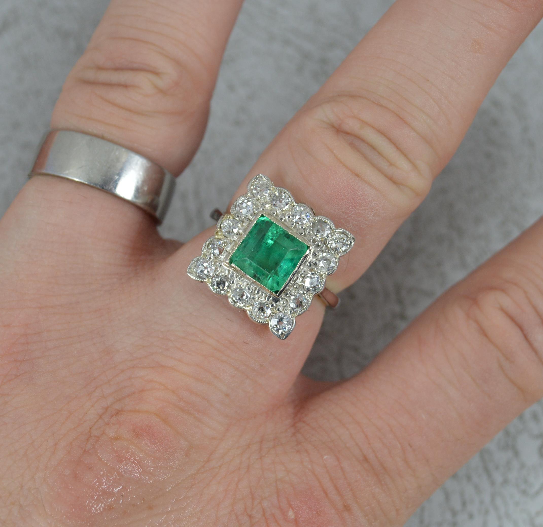 A stunning Emerald and Diamond ring of the art deco era, circa 1940.
Modelled in 18 carat white gold throughout.
Designed with a natural emerald to centre of princess cut in full grain bezel setting. 7.4mm x 7.4mm approx. Surrounding are sixteen