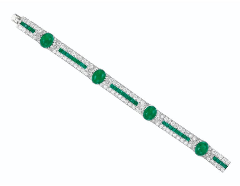 Art Deco Emerald and Diamond Bracelet. This bracelet has cabochon and square- cut emeralds, old and single-cut diamonds all set in platinum, Length 6.875 ins.