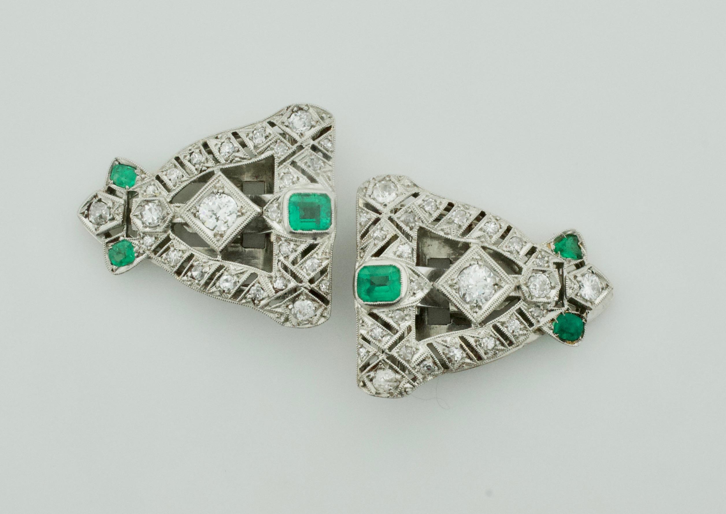 Art Deco Emerald and Diamond Brooch Clips Circa 1920's in Platinum
Two Cushion Cut Emeralds Weighing .70 Carats Approximately 
Two Old European Cut Diamonds Weighing .65 Carats Approximately Cushion Cut Emeralds Weighing .40 Carats Approximately