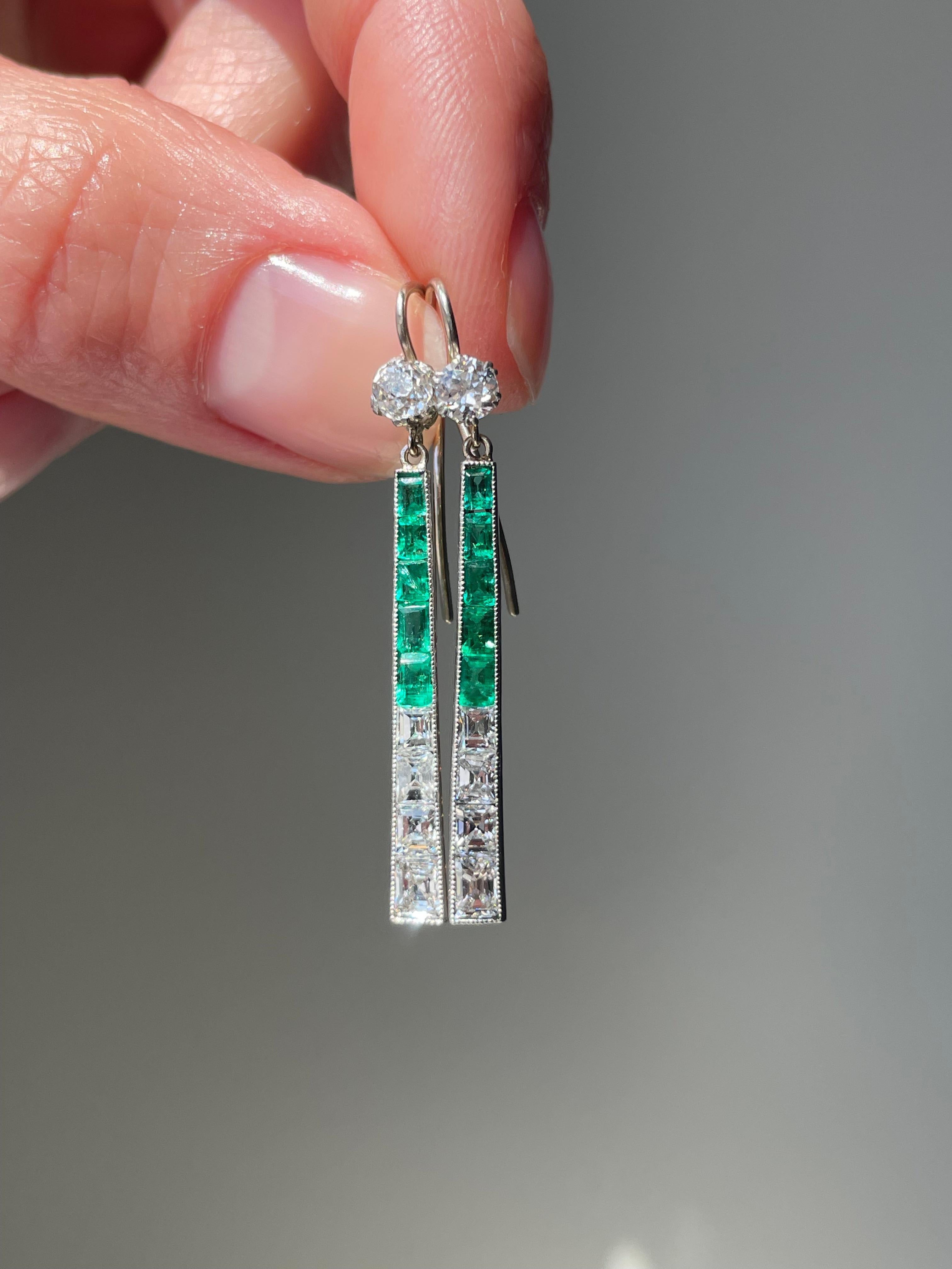 Once an Art Deco brooch that was already converted, I reimagined the components to create these fabulous dangles. A slender tapered line of crystalline green emeralds and  mirror like emerald-cut diamonds swing and sway from glittering old mine-cut