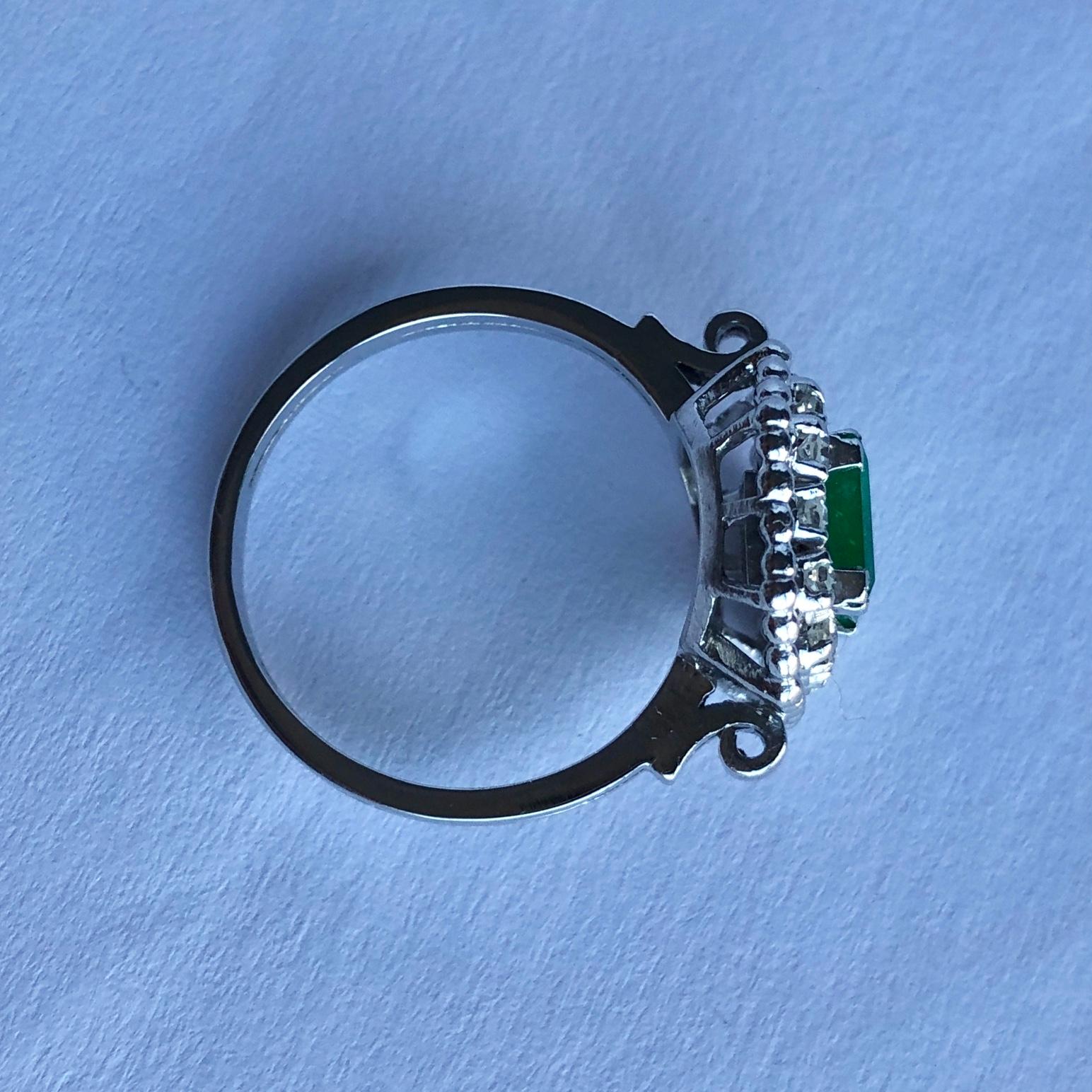 Art Deco Emerald and Diamond Platinum Cluster Ring In Good Condition For Sale In Chipping Campden, GB