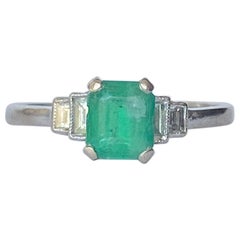 Antique Art Deco Emerald and Diamond Platinum Solitaire Ring
