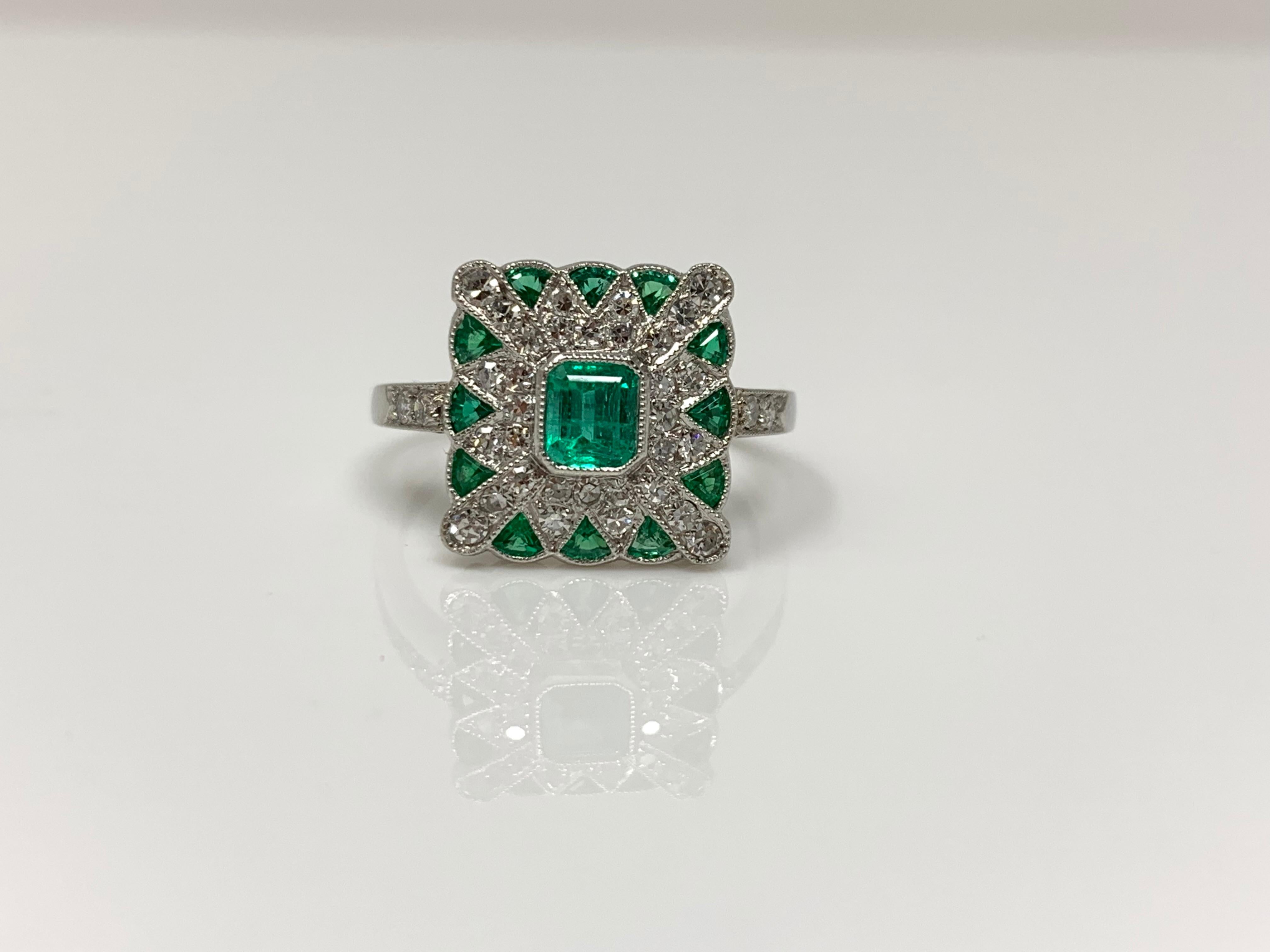 This stunning emerald and diamond ring was meticulously hand crafted in platinum. 
Diamond weight : 0.52 carat ( GH color and VS clarity)
emerald weight : 1.25 carat 
Metal : Platinum 
Ring size : 6 ( can be resized )