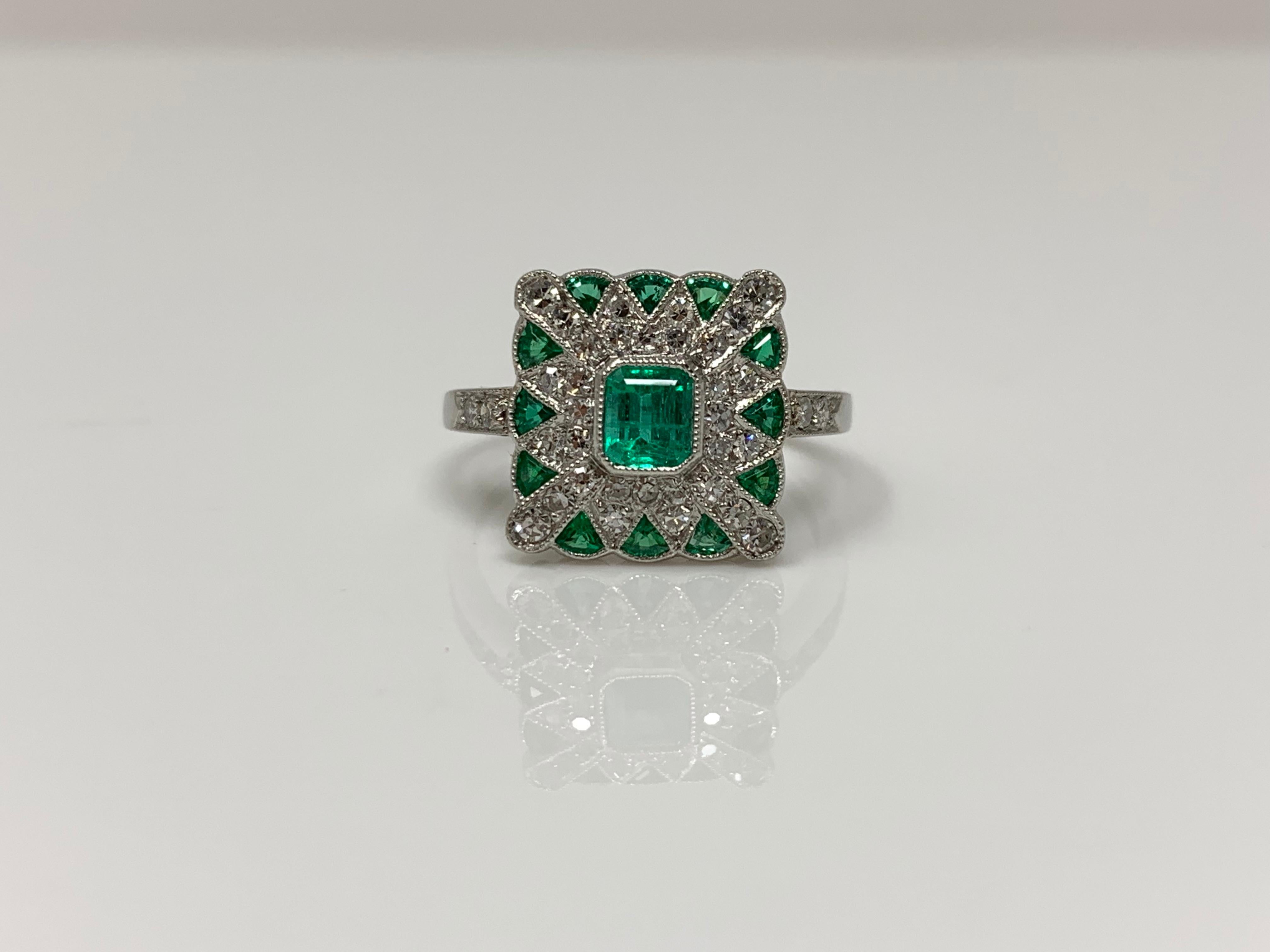 Emerald Cut Emerald and Diamond Ring in Platinum